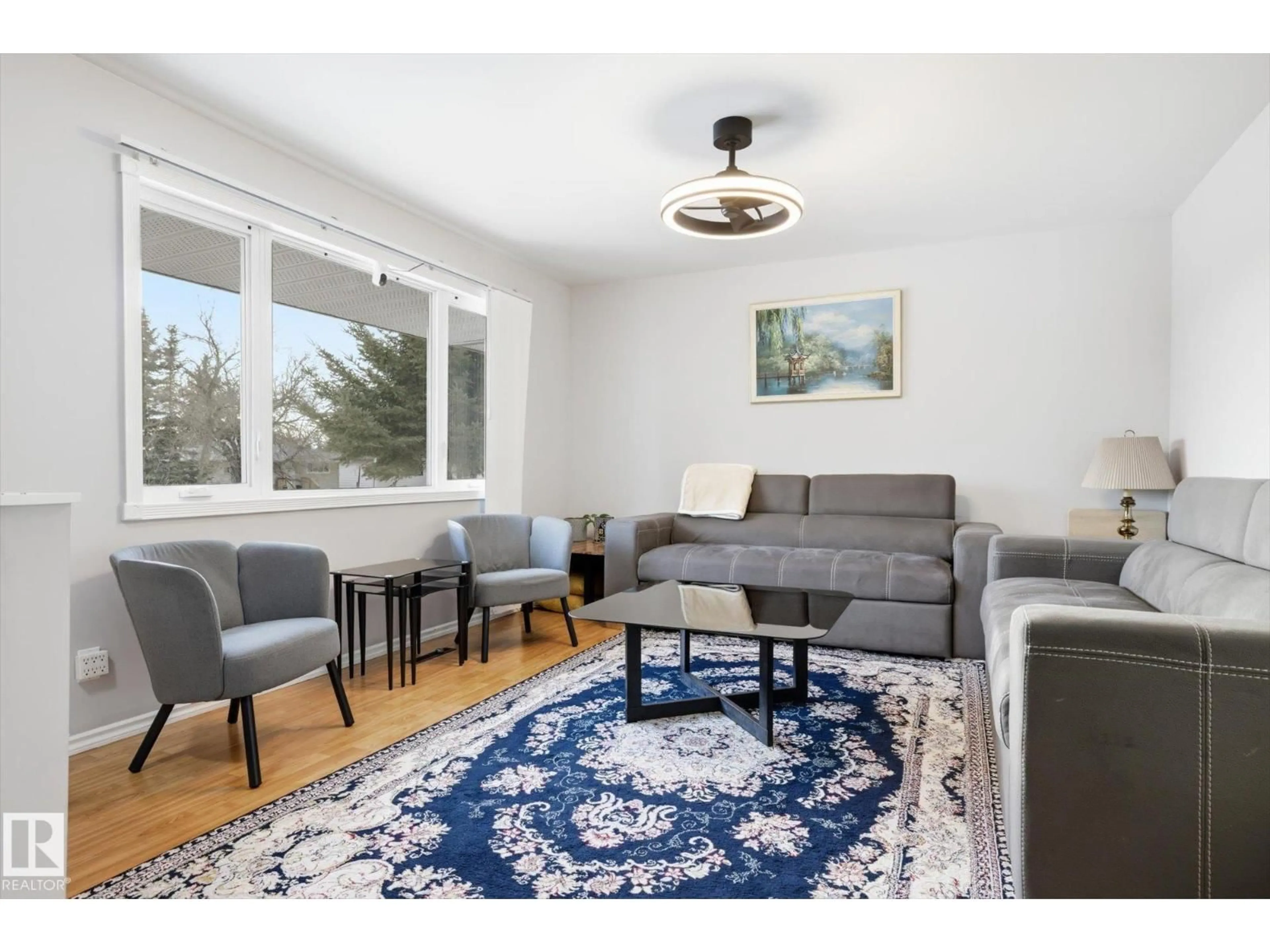 Living room with furniture, wood/laminate floor for NW - 10518 163 ST, Edmonton Alberta T5P3P1