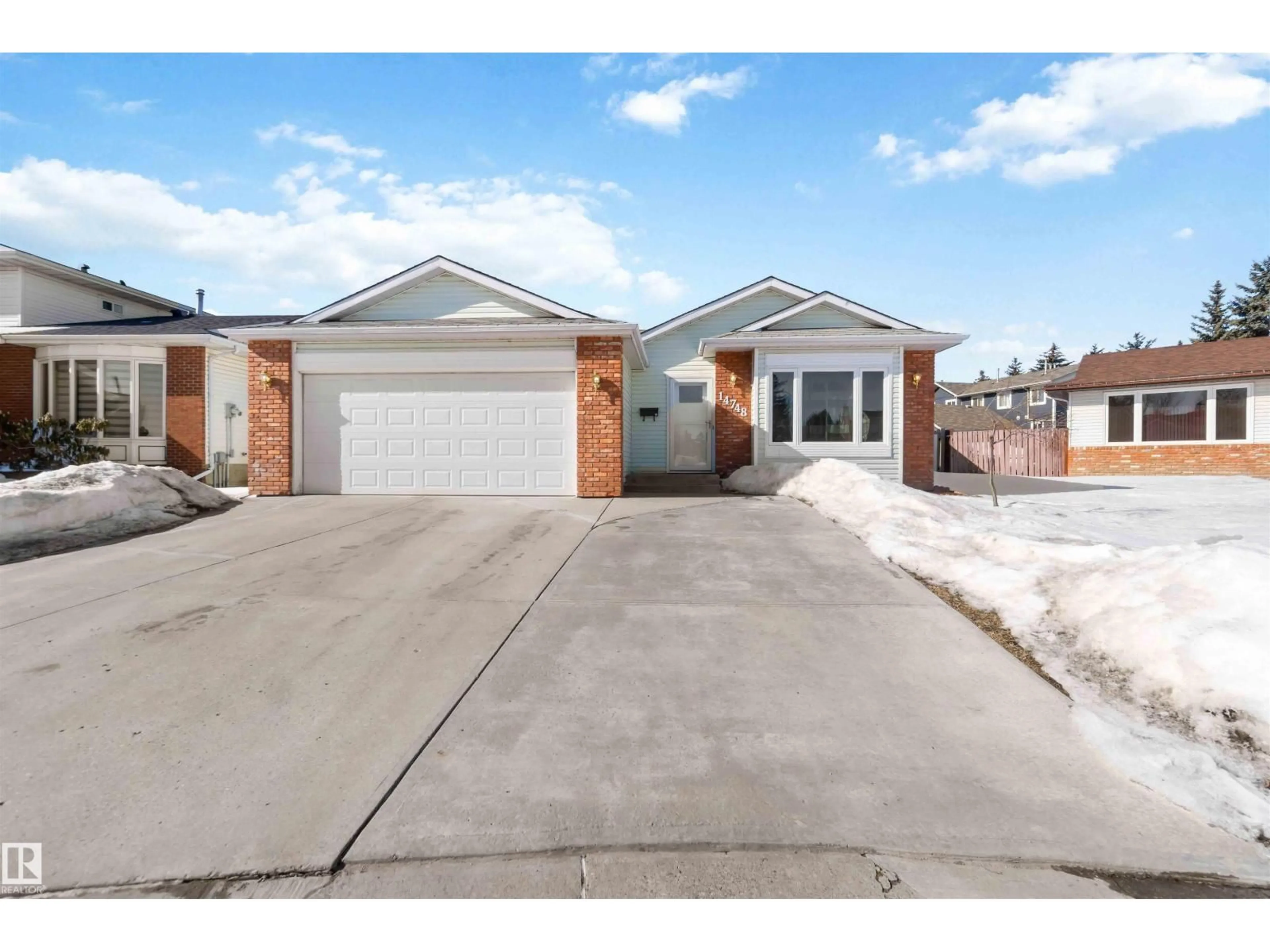 Home with brick exterior material, street for NW - 14748 33 ST, Edmonton Alberta T5Y2G2