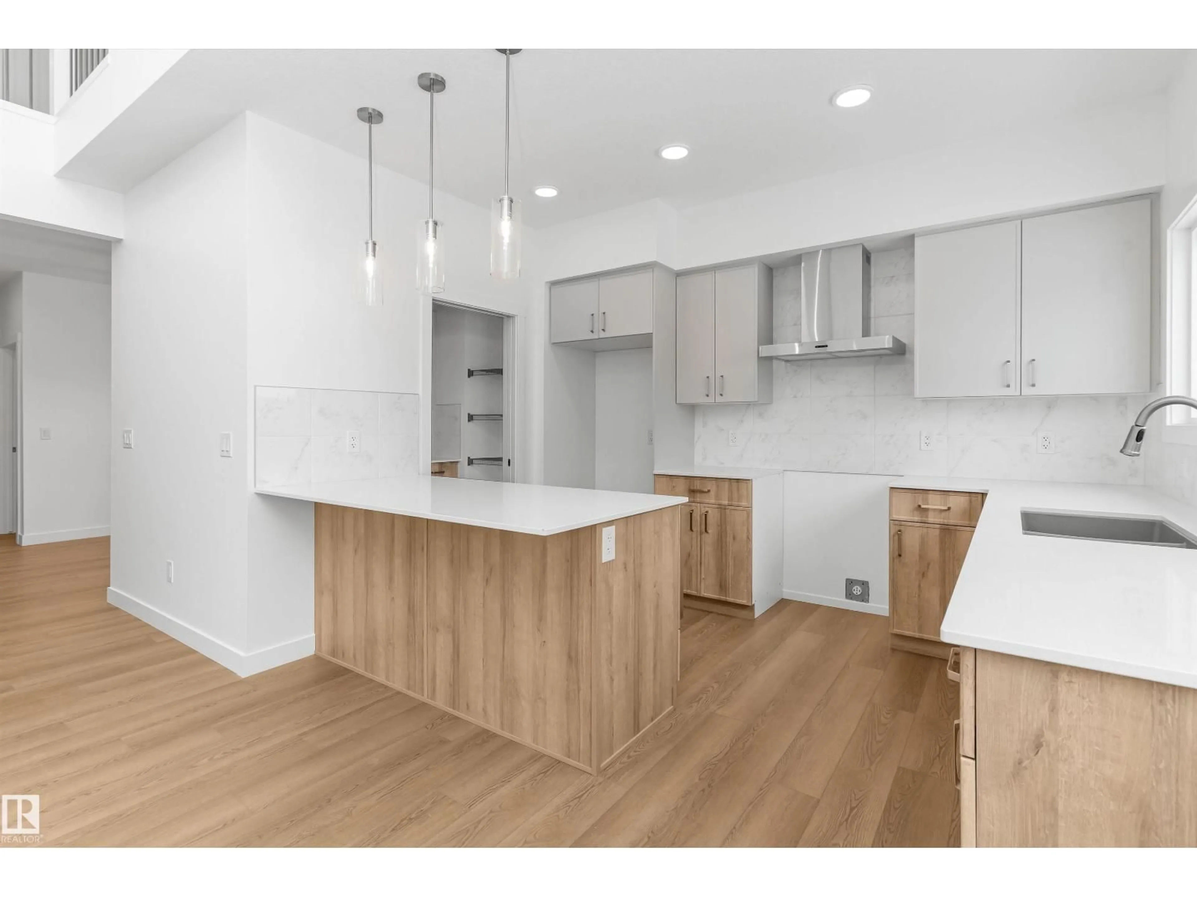 Open concept kitchen, wood/laminate floor for NW - 2209 194A ST, Edmonton Alberta T6M3J3