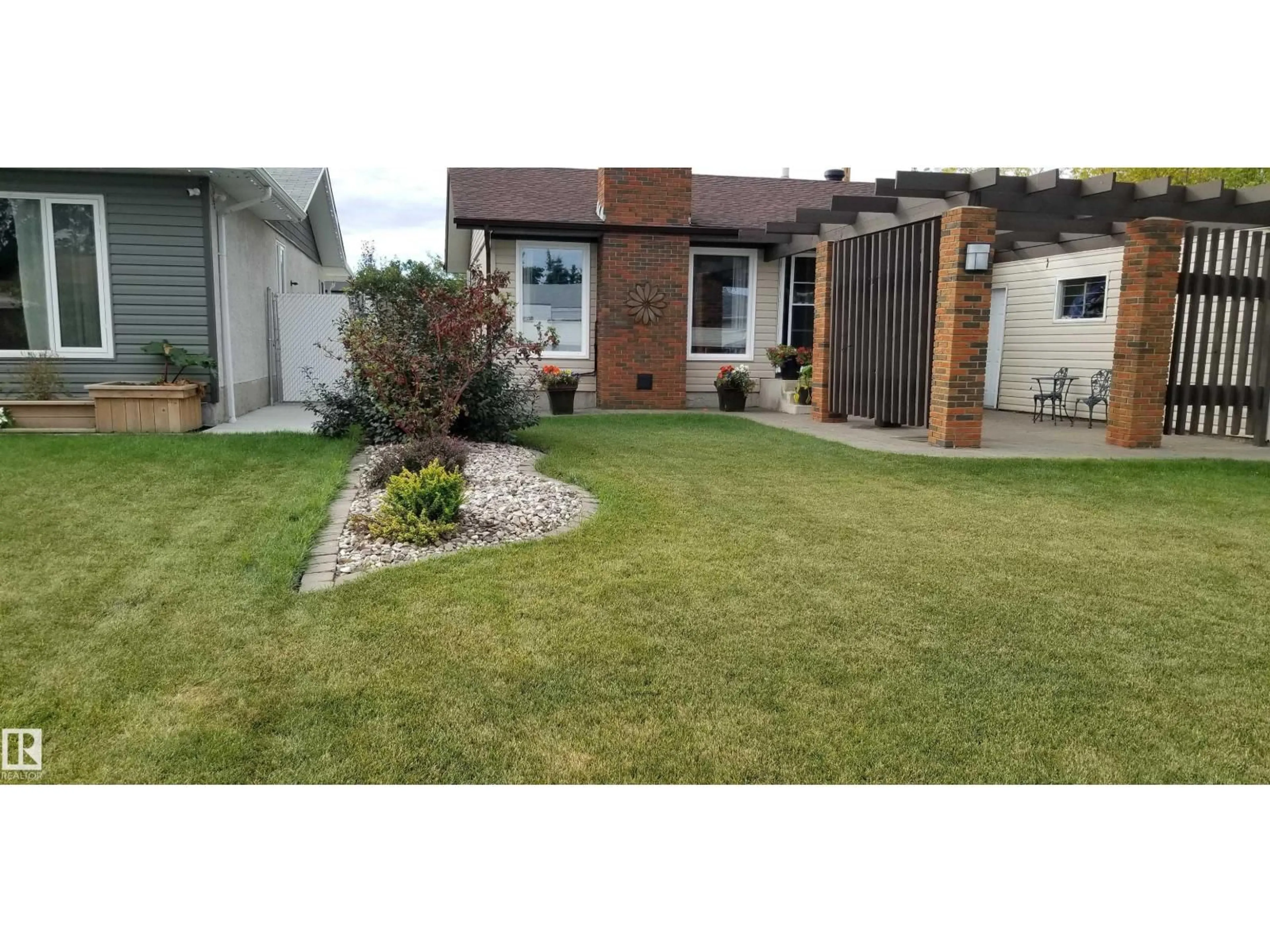 A pic from outside/outdoor area/front of a property/back of a property/a pic from drone, street for 12127 152A AV, Edmonton Alberta T5X1R1