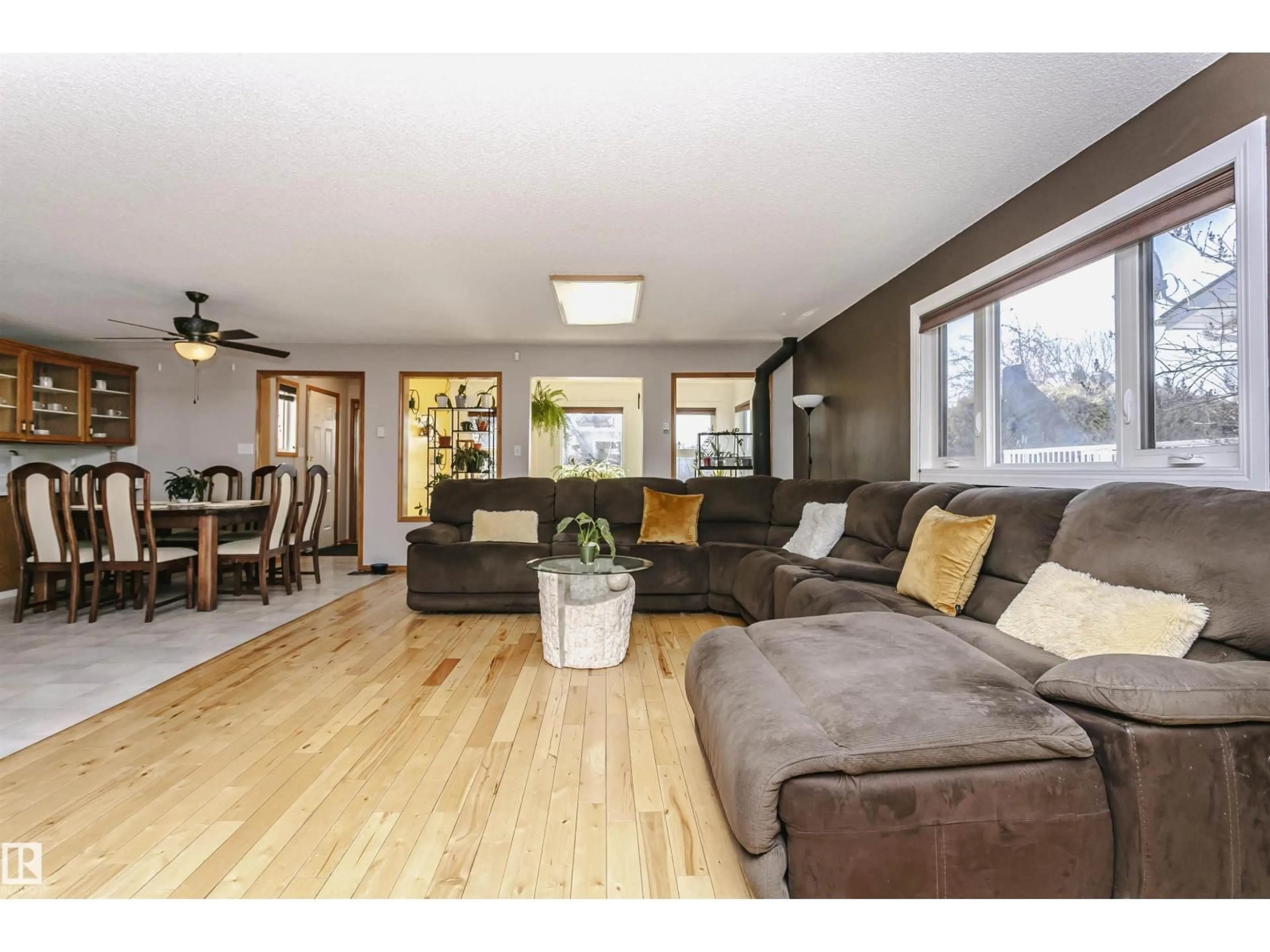 Living room with furniture, wood/laminate floor for 6119 154 AV, Edmonton Alberta T5Y2N2