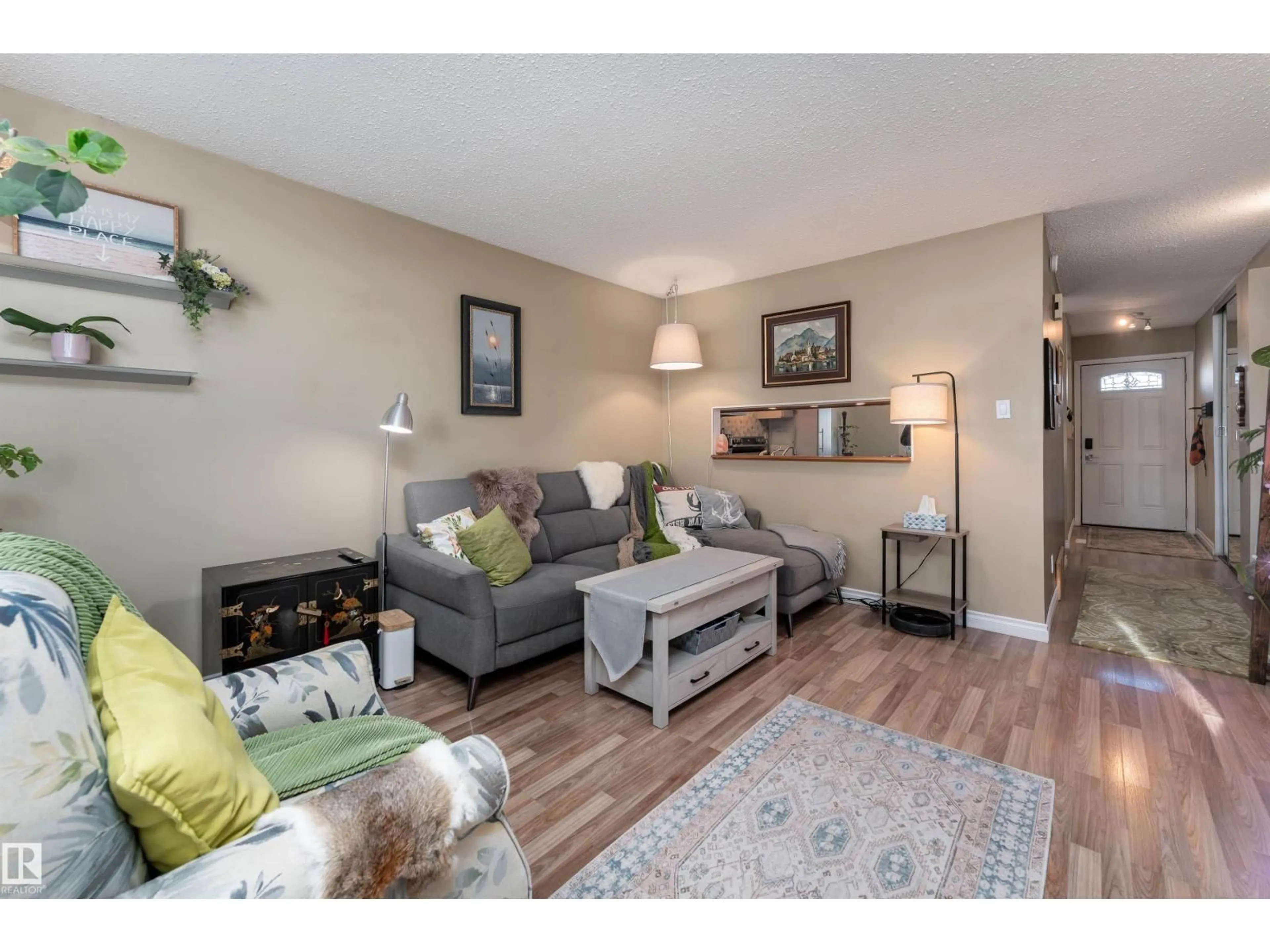 Living room with furniture, wood/laminate floor for 1229 62 ST, Edmonton Alberta T6L2H6