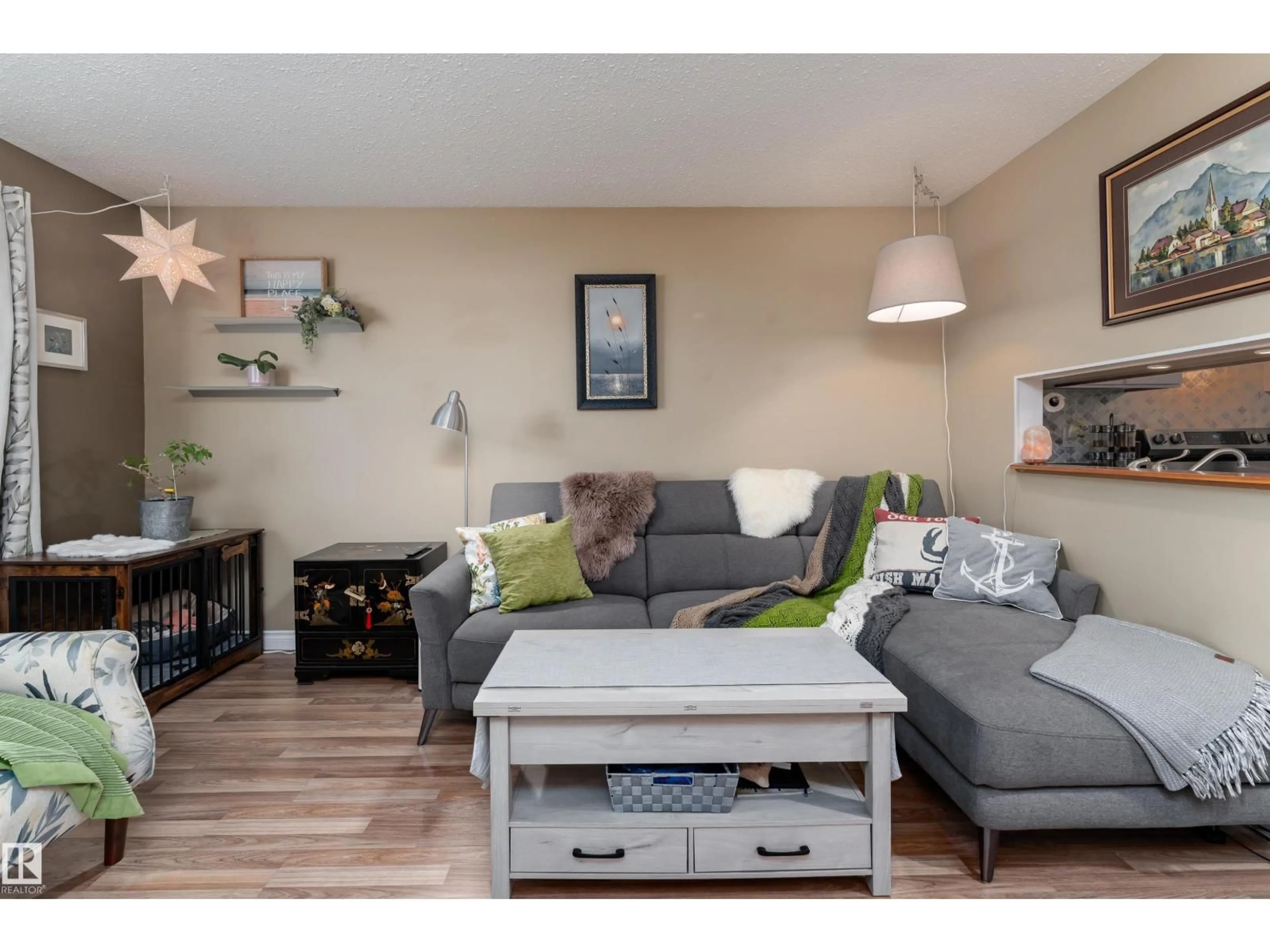 Living room with furniture, wood/laminate floor for 1229 62 ST, Edmonton Alberta T6L2H6