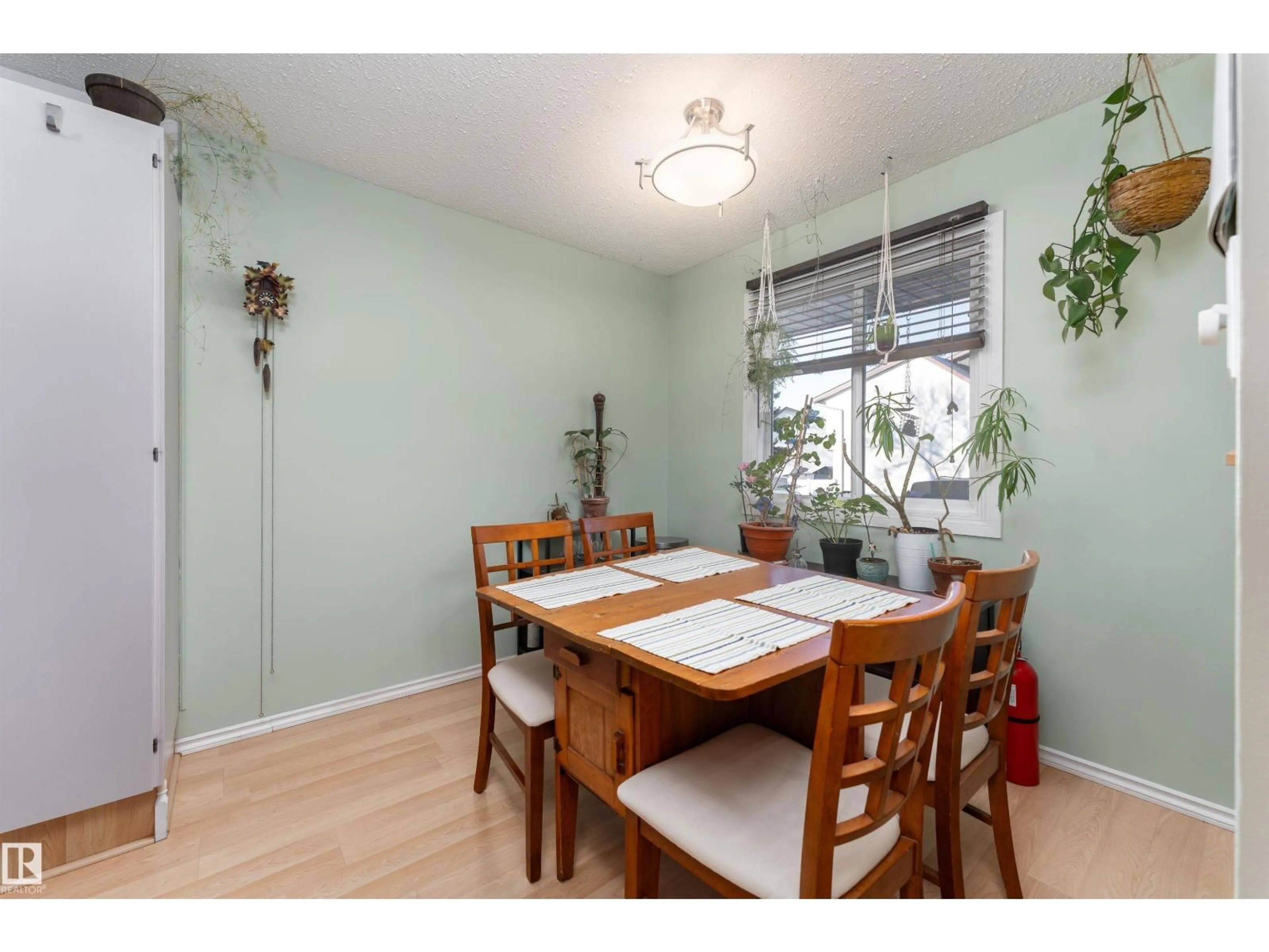 Dining room, wood/laminate floor for 1229 62 ST, Edmonton Alberta T6L2H6