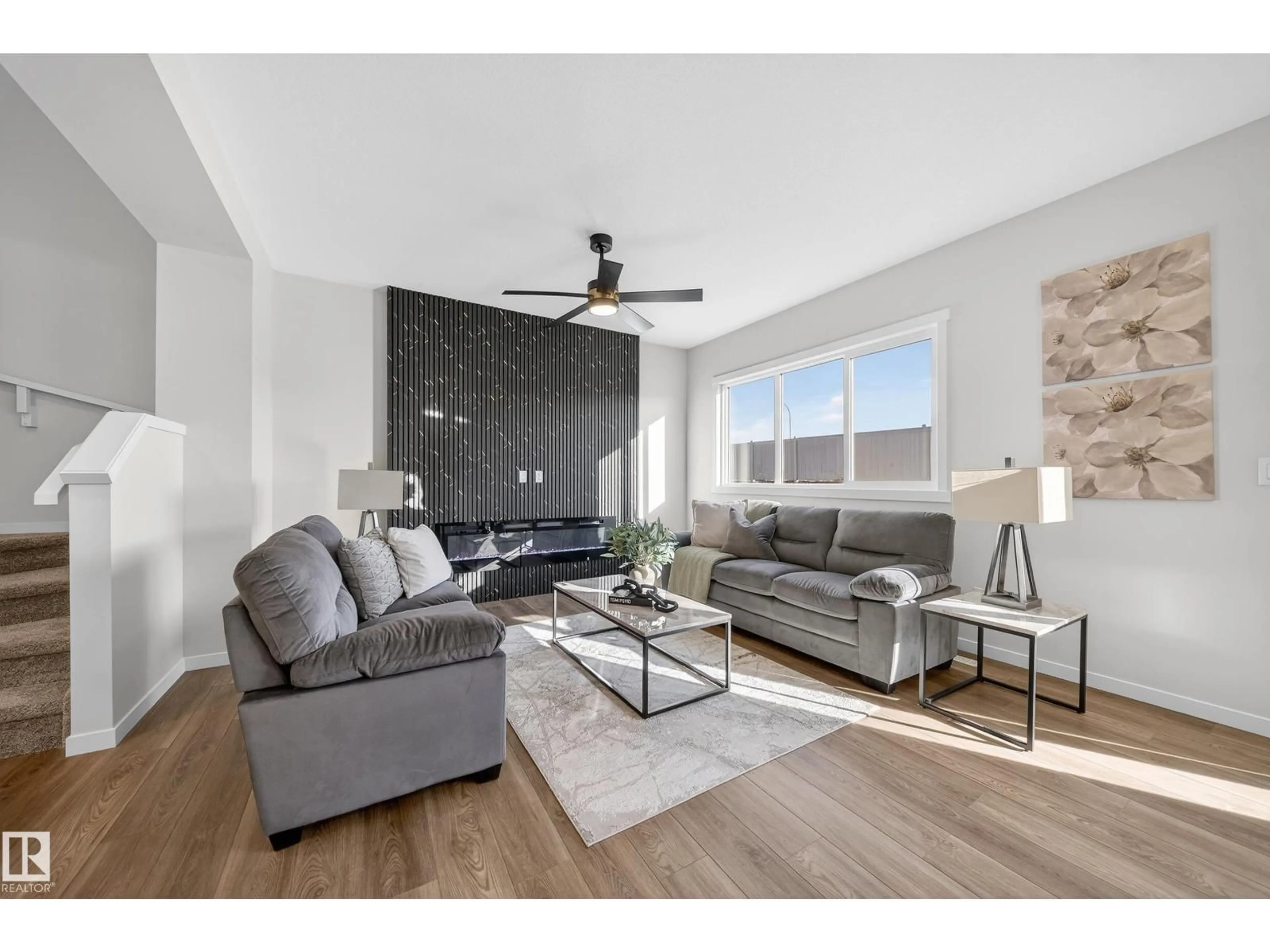 Living room with furniture, wood/laminate floor for 20723 24 AV, Edmonton Alberta T6M2C4