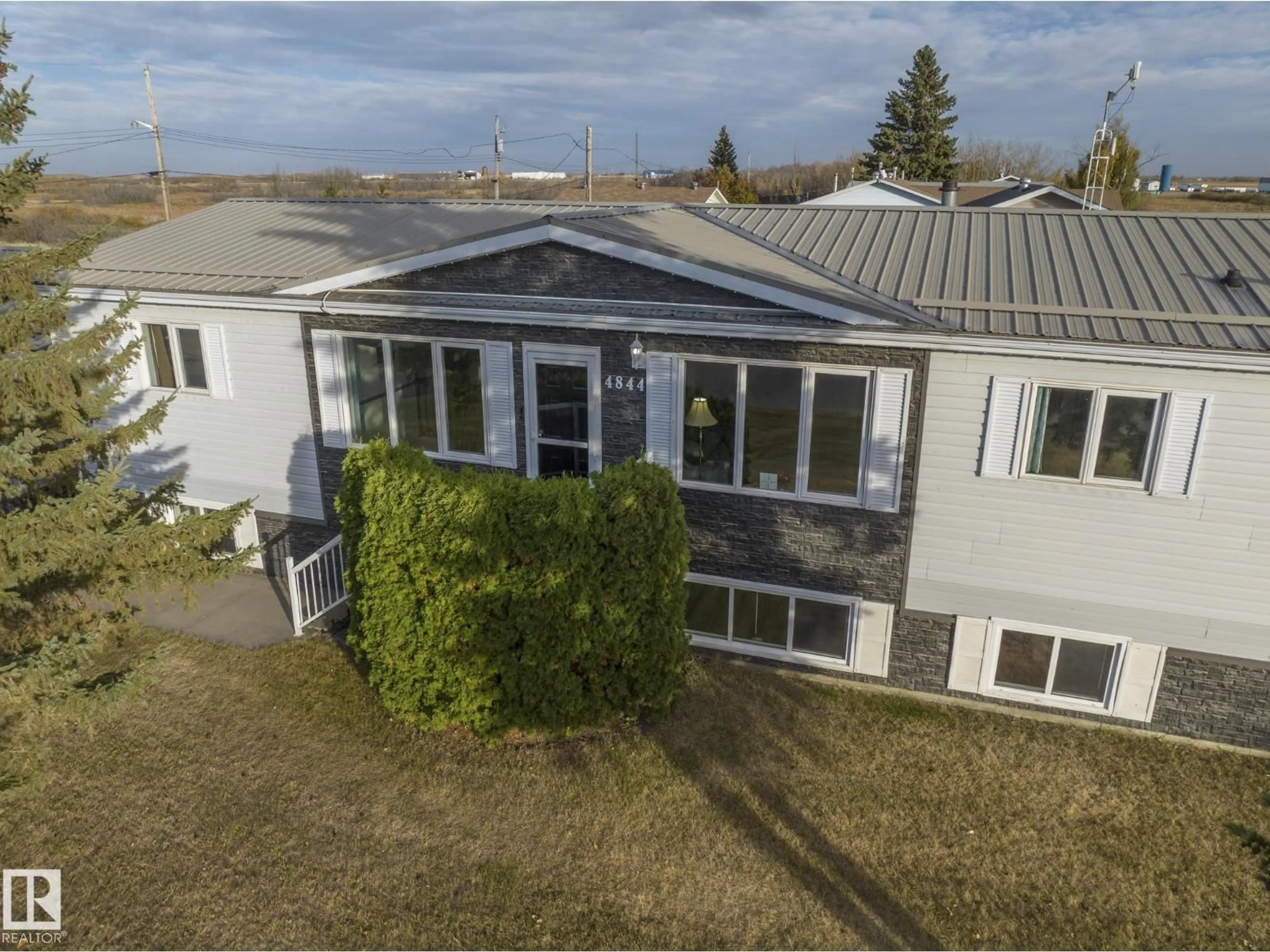 A pic from outside/outdoor area/front of a property/back of a property/a pic from drone, building for 4844 54 AV, Ryley Alberta T0B4A0