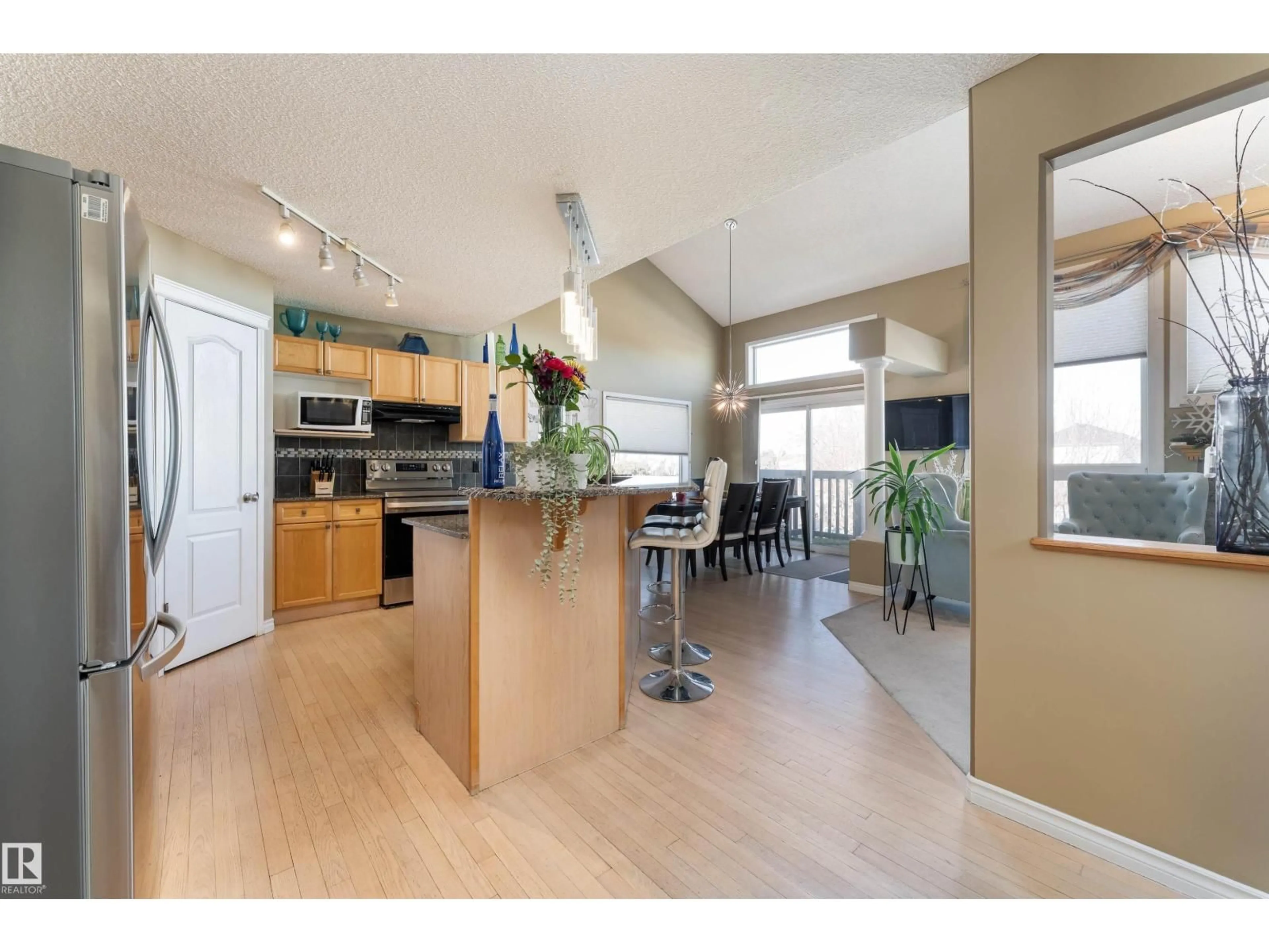 Open concept kitchen, wood/laminate floor for NW - 2860 37C AV, Edmonton Alberta T6T1M3