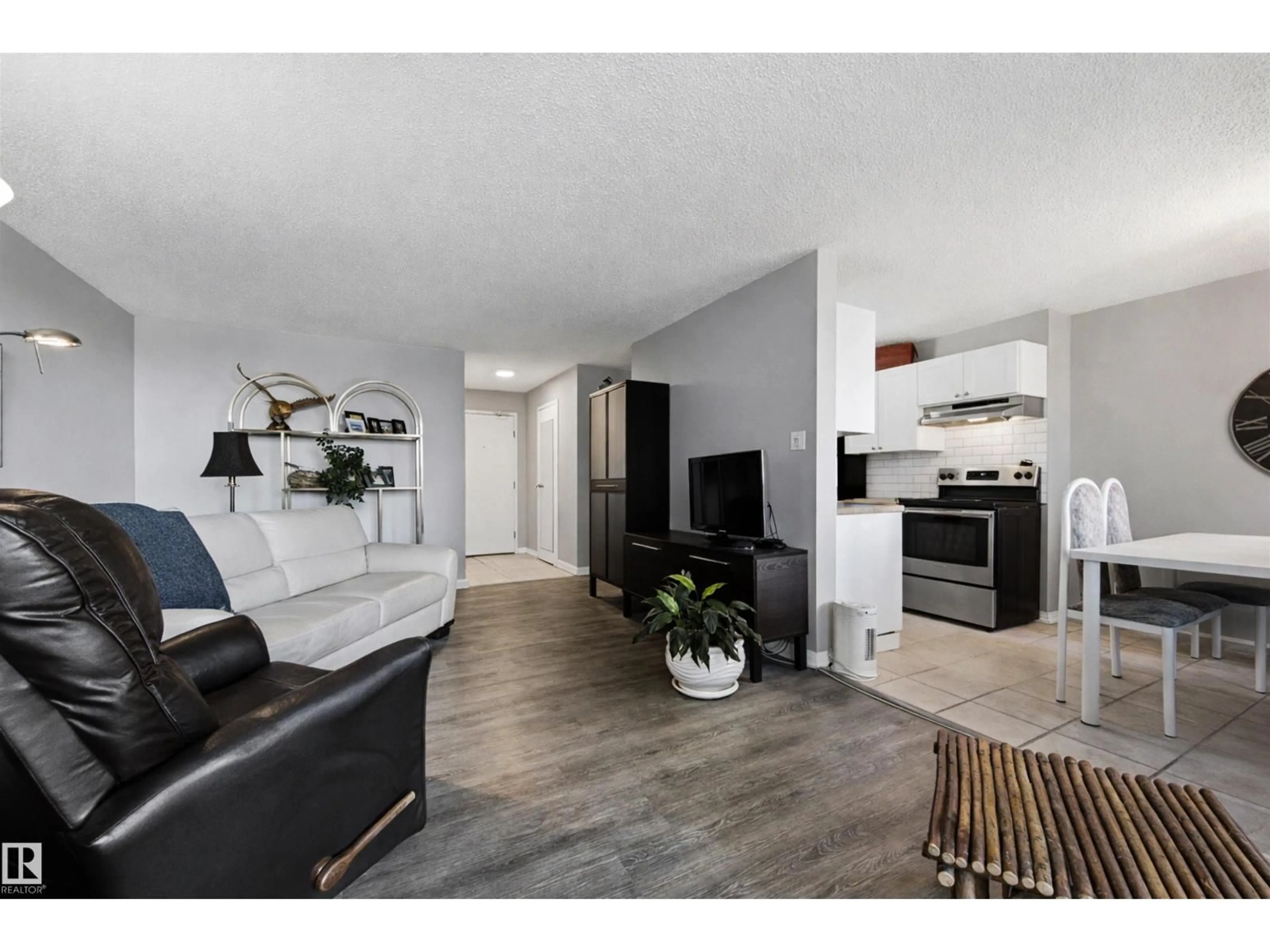 Living room with furniture, wood/laminate floor for #504 - 10015 119 ST, Edmonton Alberta T5K1Y7