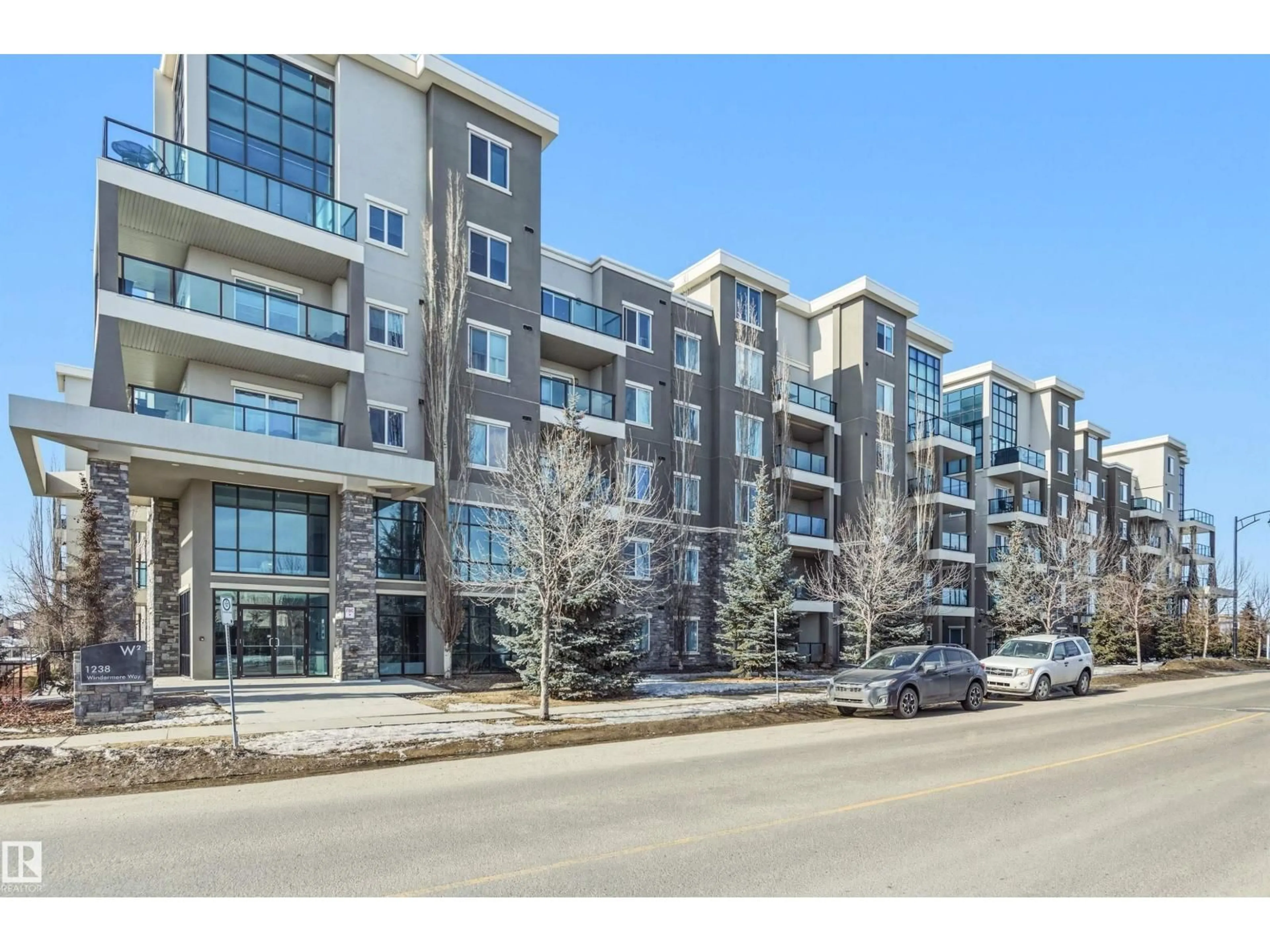 A pic from outside/outdoor area/front of a property/back of a property/a pic from drone, street for #106 - 1238 WINDERMERE WY, Edmonton Alberta T6W2J3