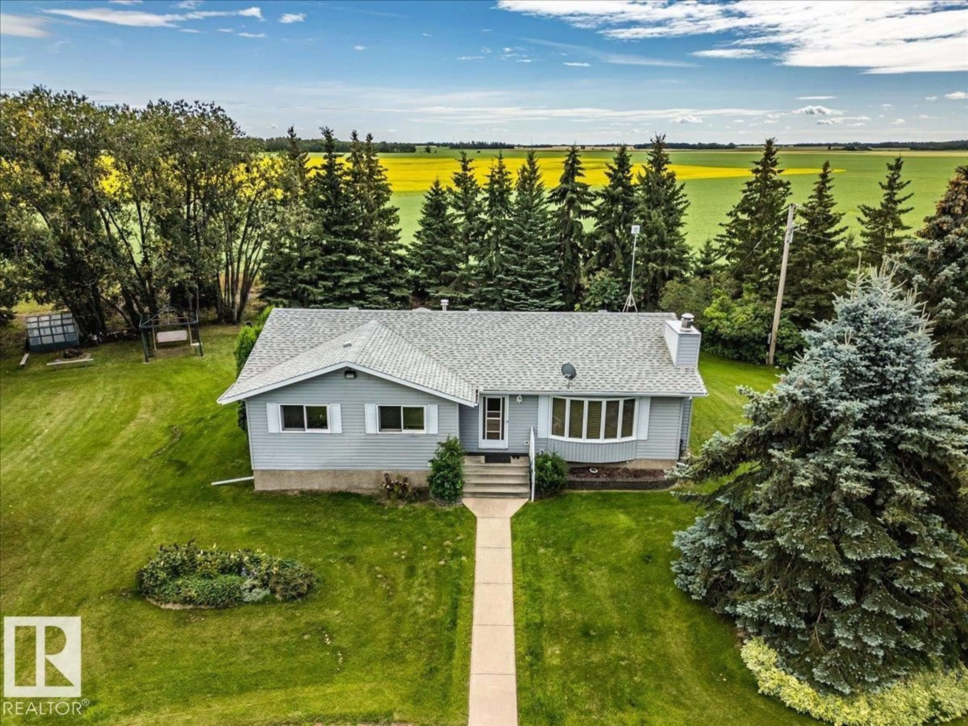 A pic from outside/outdoor area/front of a property/back of a property/a pic from drone, water/lake/river/ocean view for 460077 RGE ROAD 253, Rural Wetaskiwin County Alberta T9A1X2