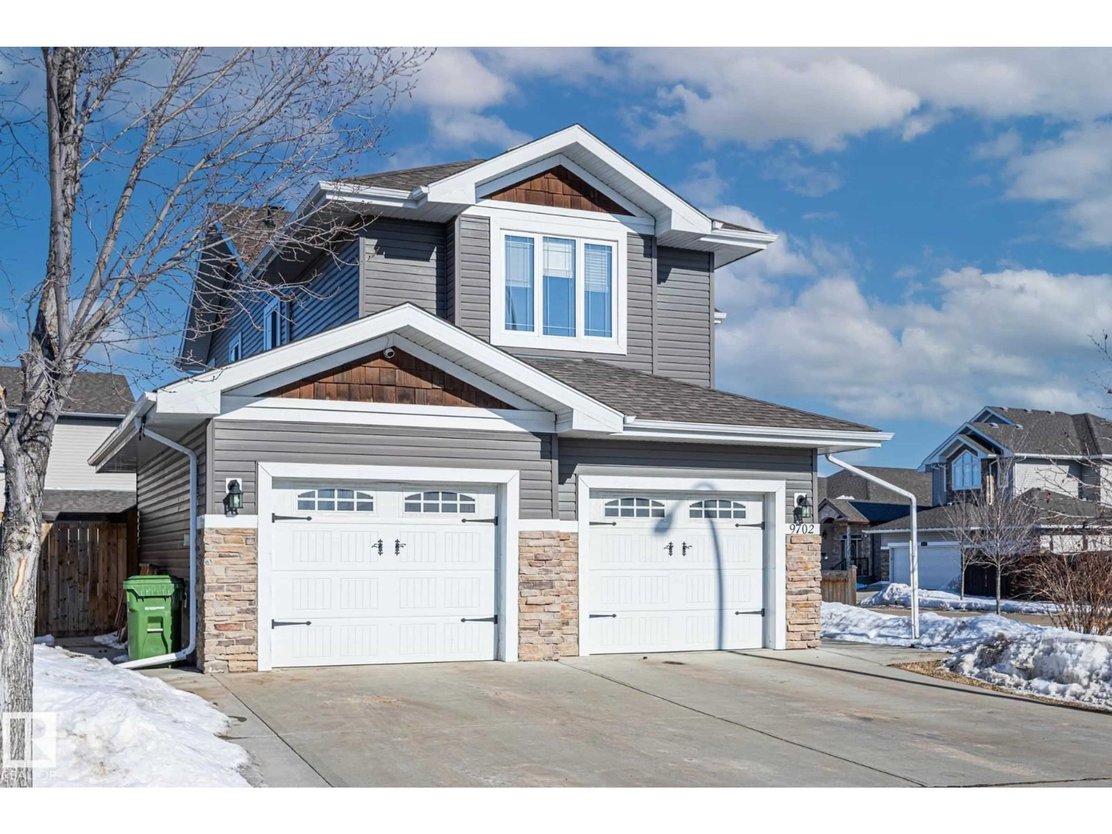 Home with vinyl exterior material, street for 9702 104 AV, Morinville Alberta T8R0B6