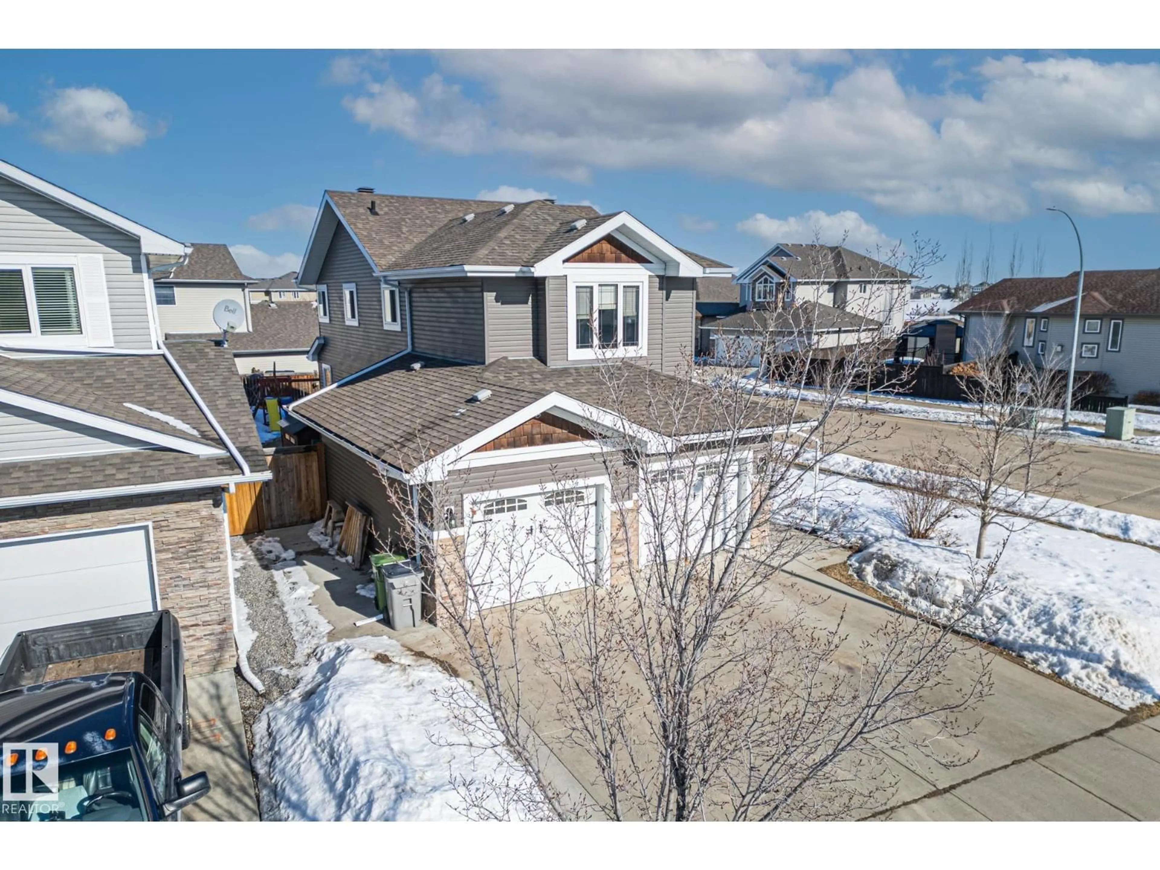A pic from outside/outdoor area/front of a property/back of a property/a pic from drone, street for 9702 104 AV, Morinville Alberta T8R0B6