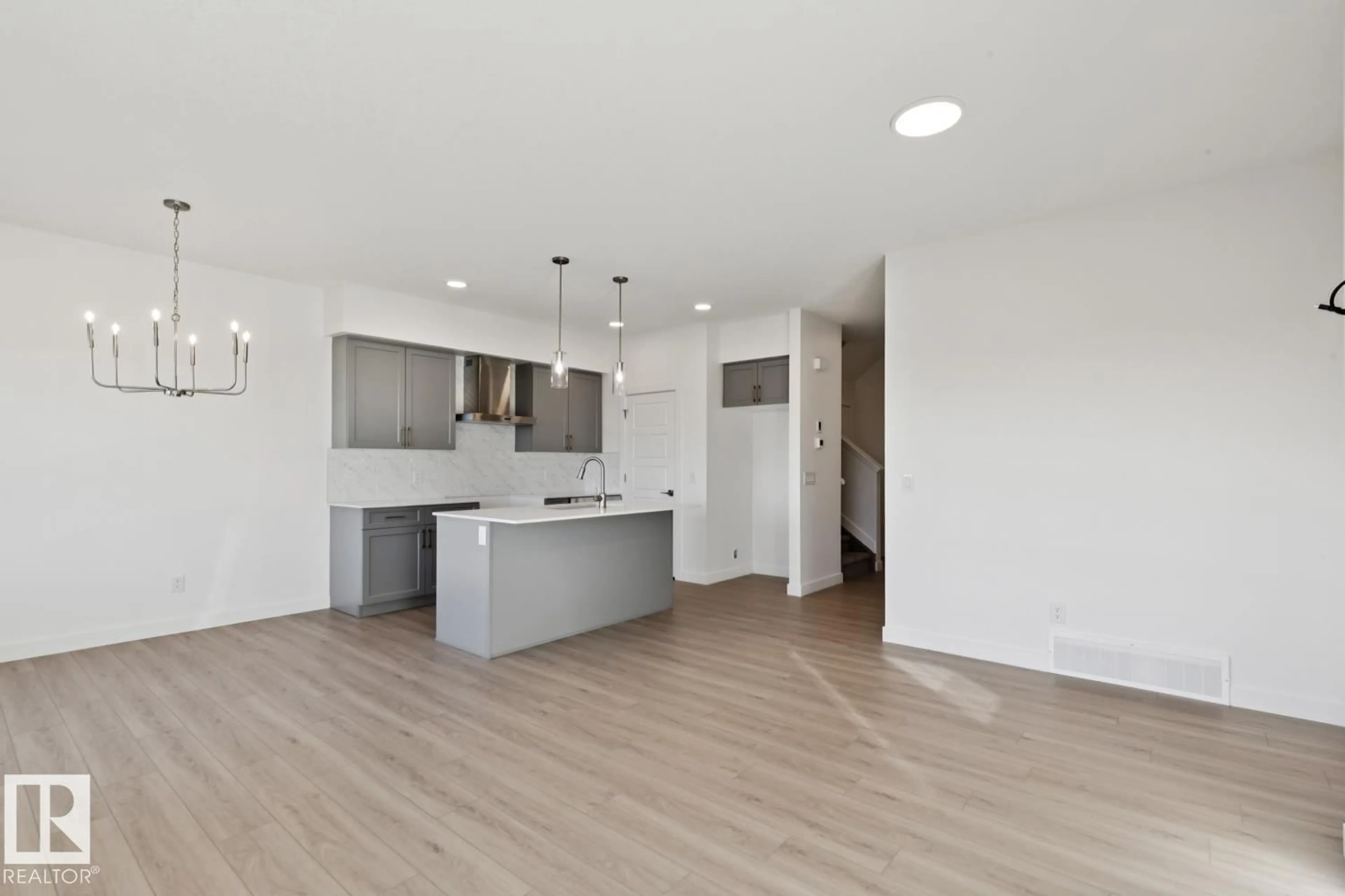 Open concept kitchen, wood/laminate floor for 19131 20 AV, Edmonton Alberta T6M3E8