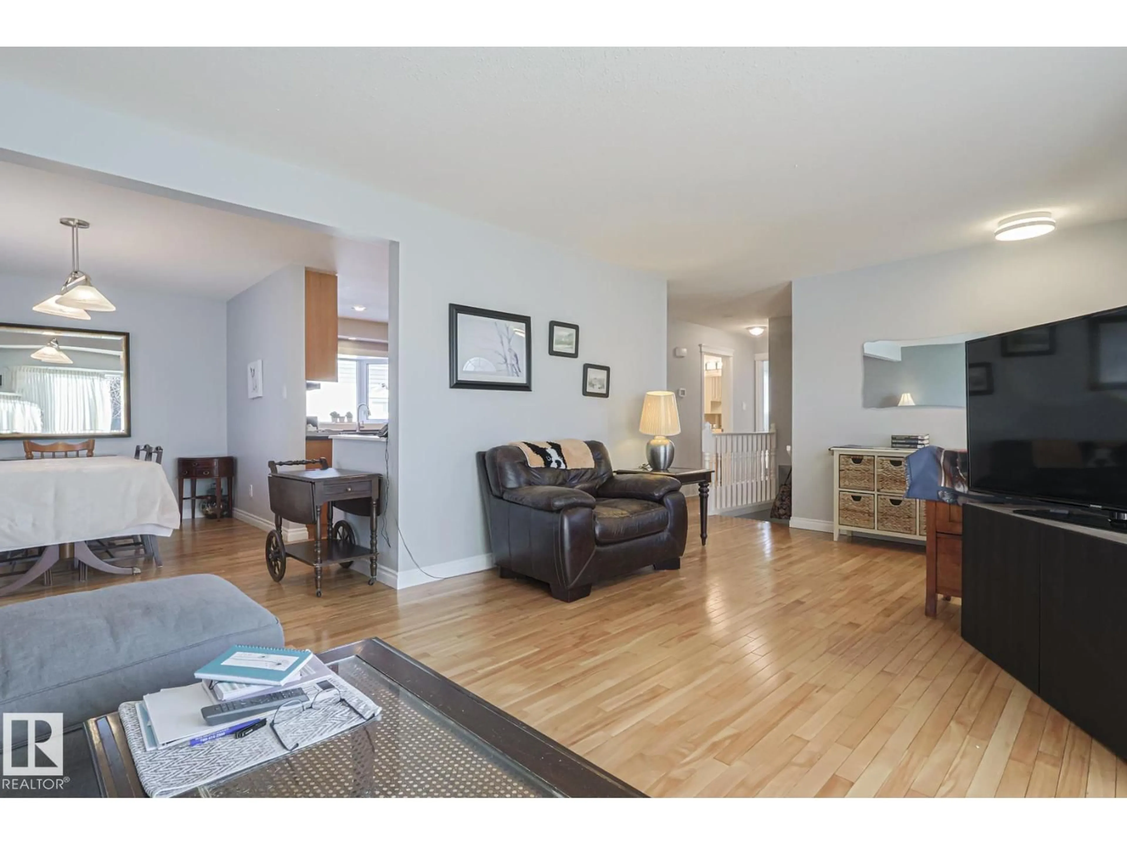 Living room with furniture, wood/laminate floor for 11148 41 AV, Edmonton Alberta T6J0T4