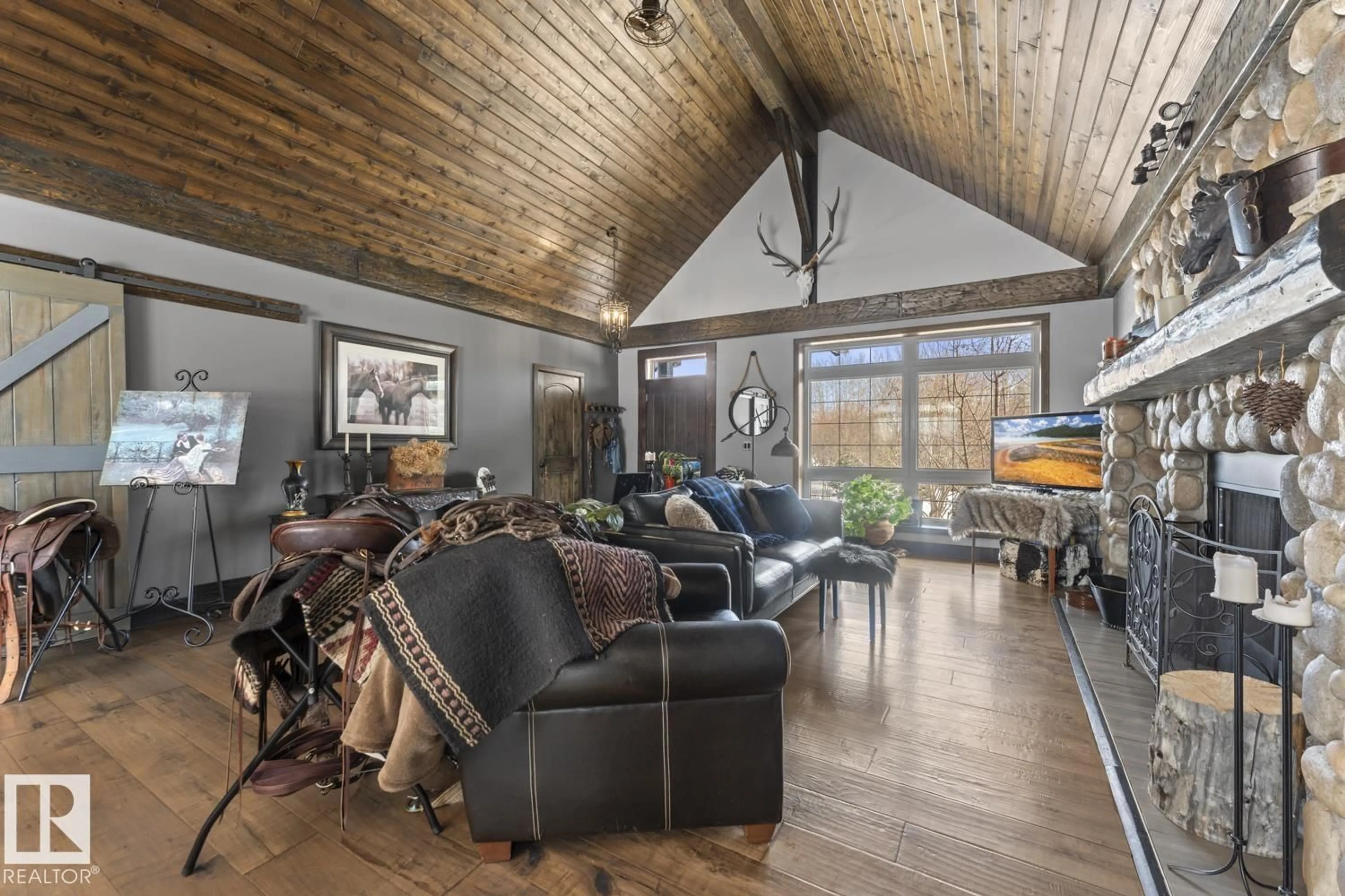 Living room with furniture, wood/laminate floor for 62312 RR 421, Rural Bonnyville M.D. Alberta T0A0T0