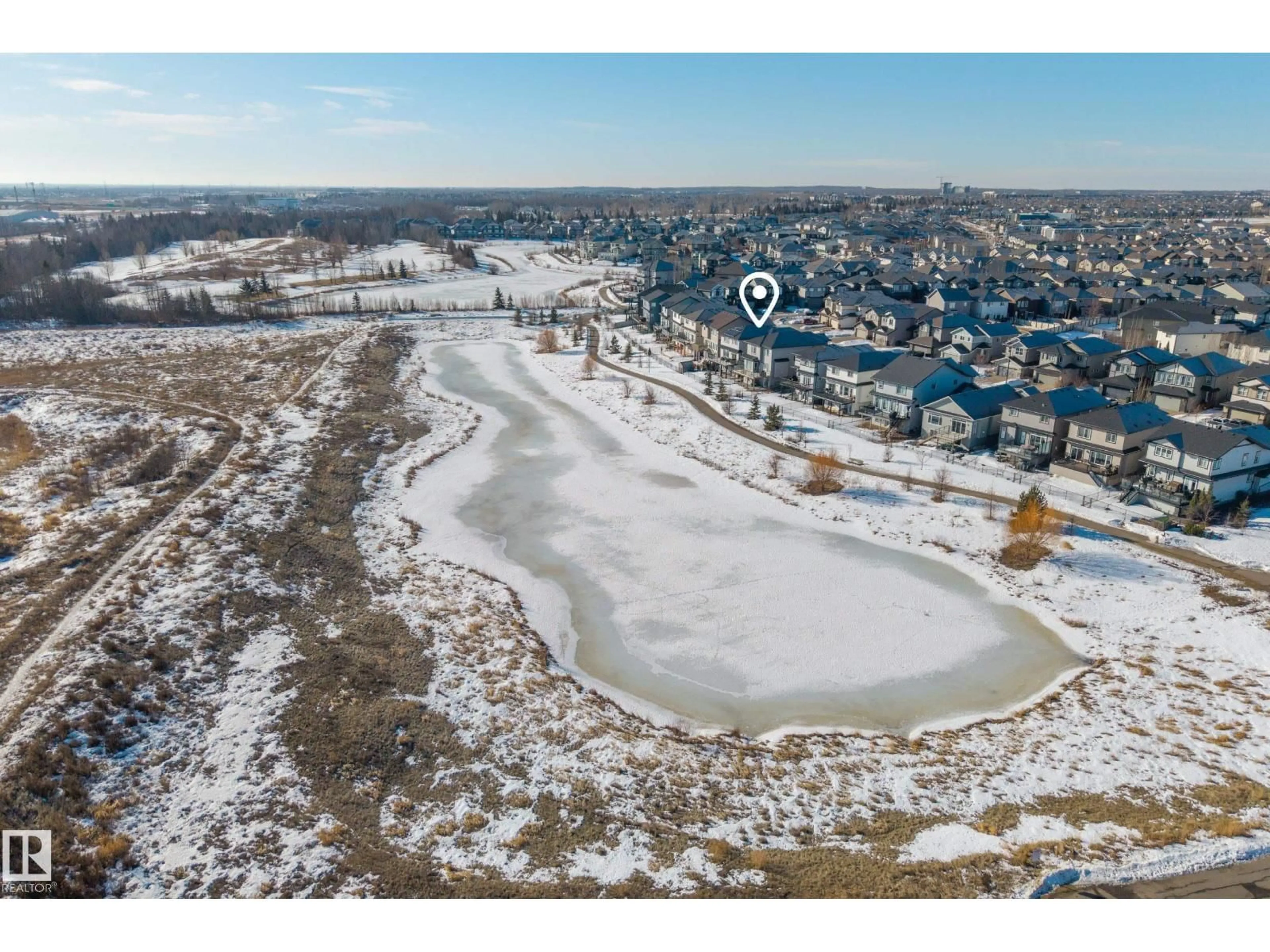 A pic from outside/outdoor area/front of a property/back of a property/a pic from drone, water/lake/river/ocean view for NW - 9727 205 ST, Edmonton Alberta T5T4V7