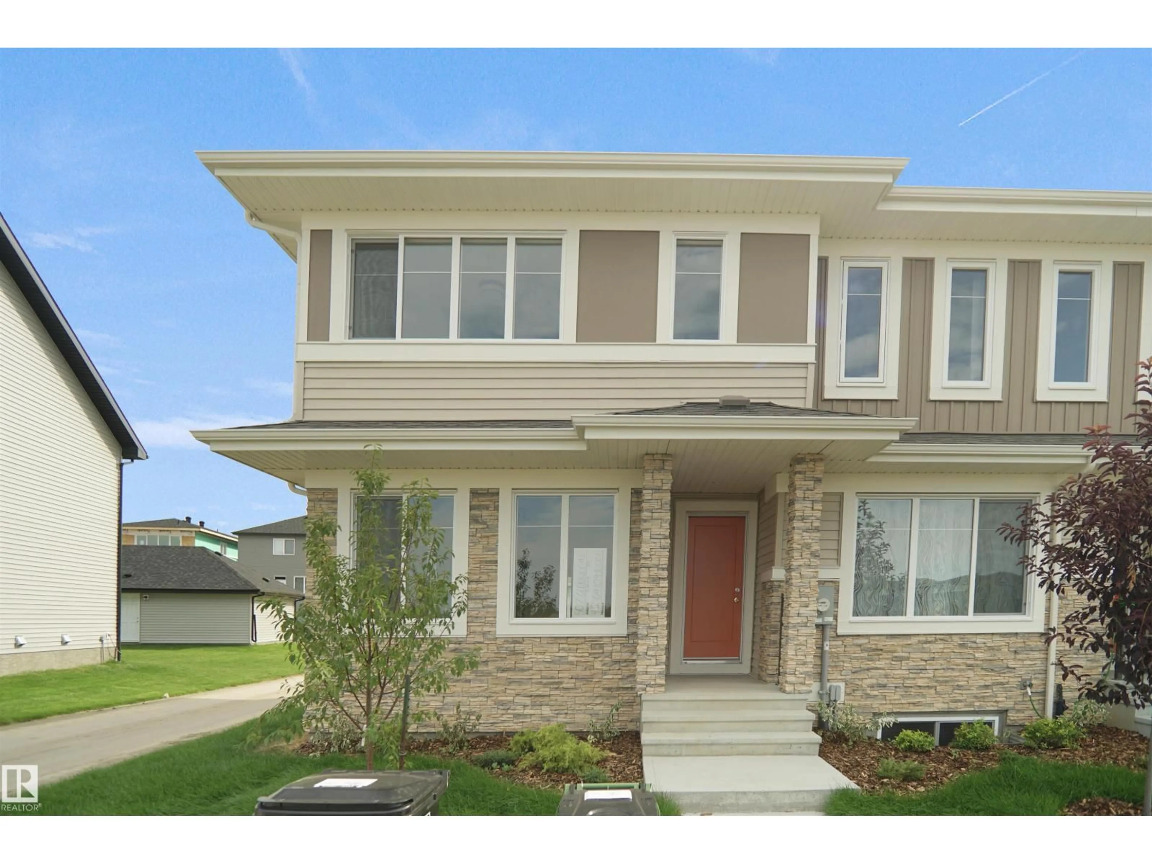 Home with brick exterior material, street for 19457 22 AV, Edmonton Alberta T6M3J3