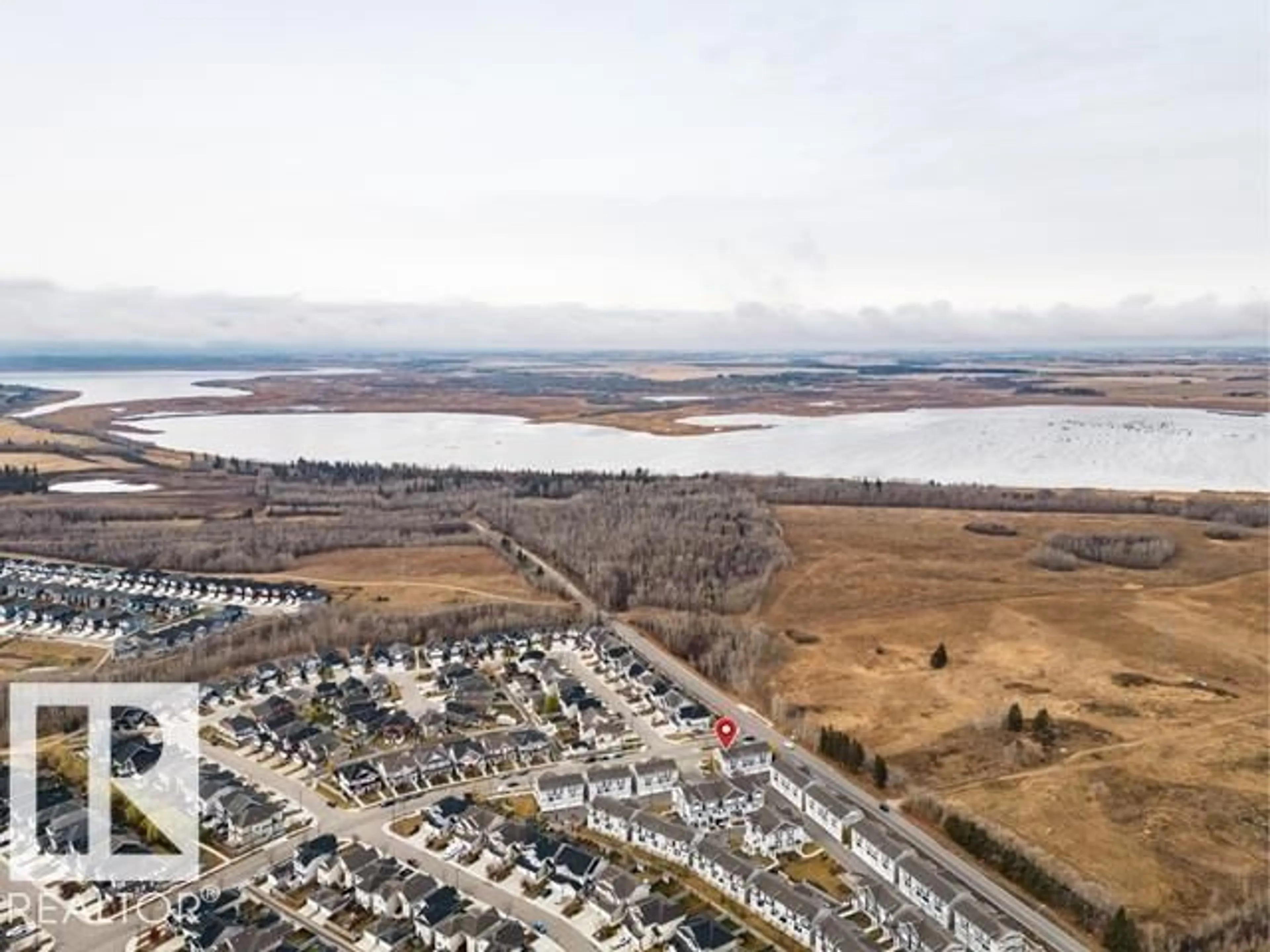 A pic from outside/outdoor area/front of a property/back of a property/a pic from drone, water/lake/river/ocean view for #10 - 1391 STARLING DR, Edmonton Alberta T5S0L3