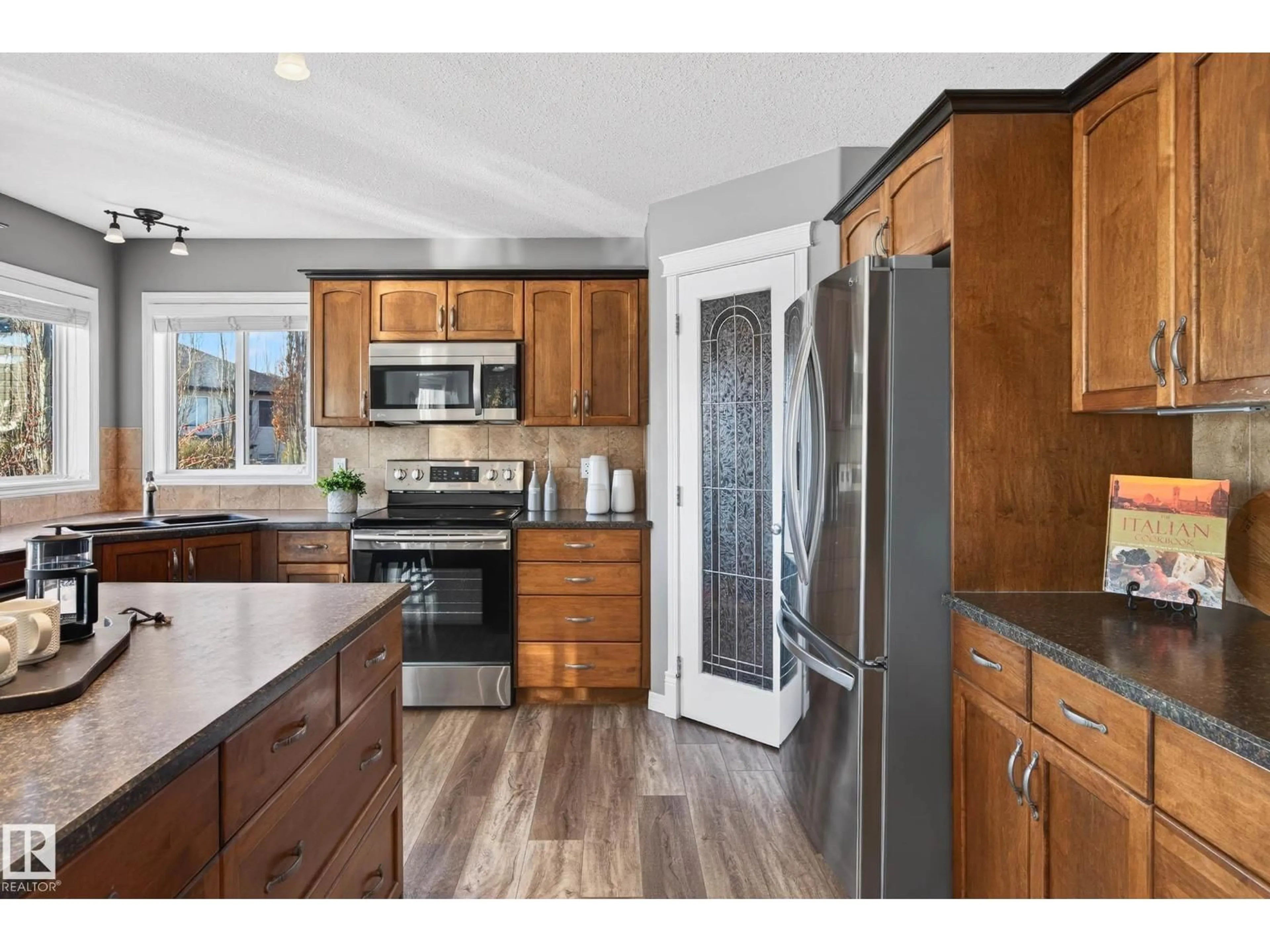 Open concept kitchen, wood/laminate floor for 96 RUE MARSEILLE, Beaumont Alberta T4X1T2