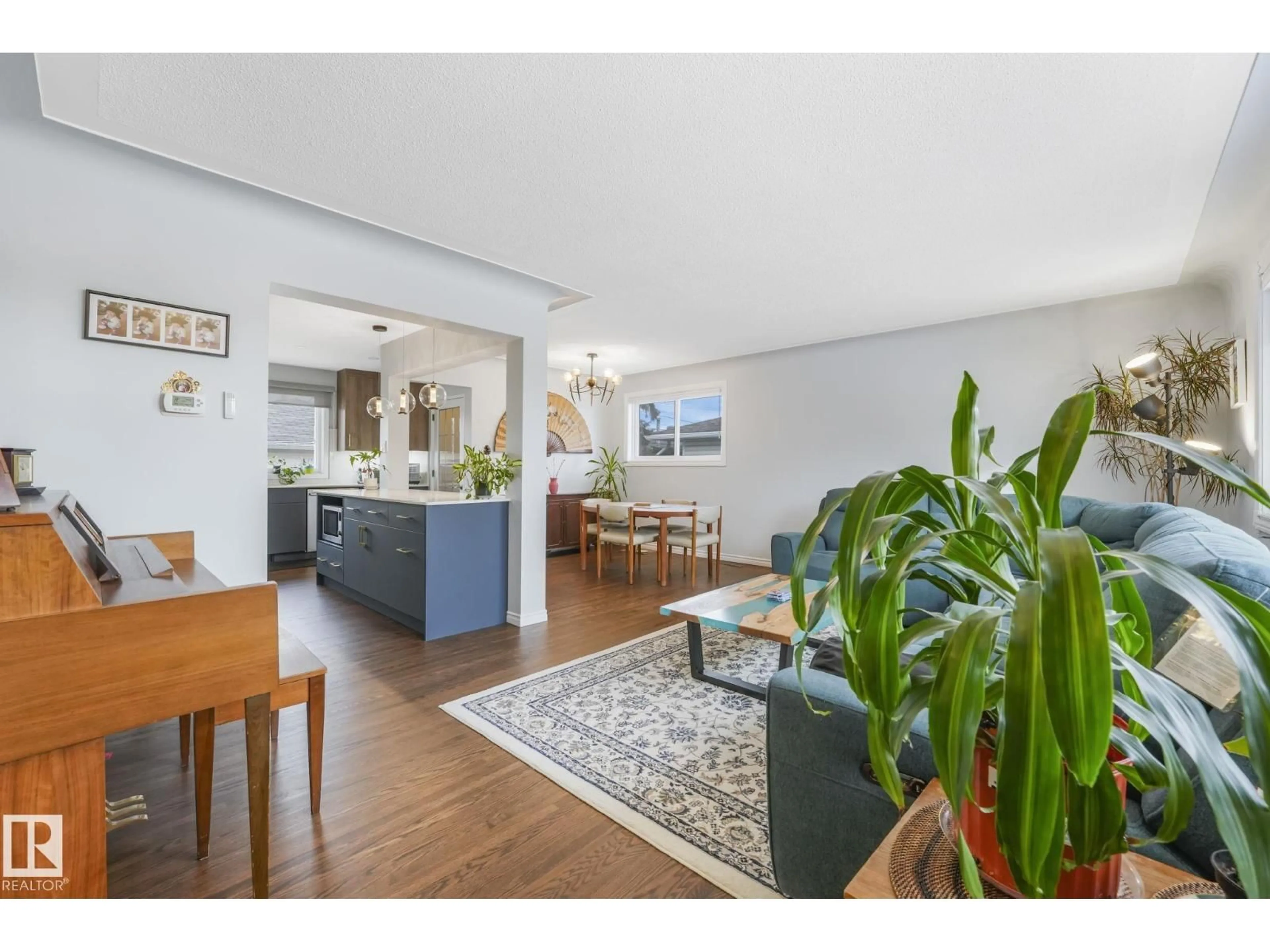 Living room with furniture, wood/laminate floor for 9508 OTTEWELL RD, Edmonton Alberta T6B2E5