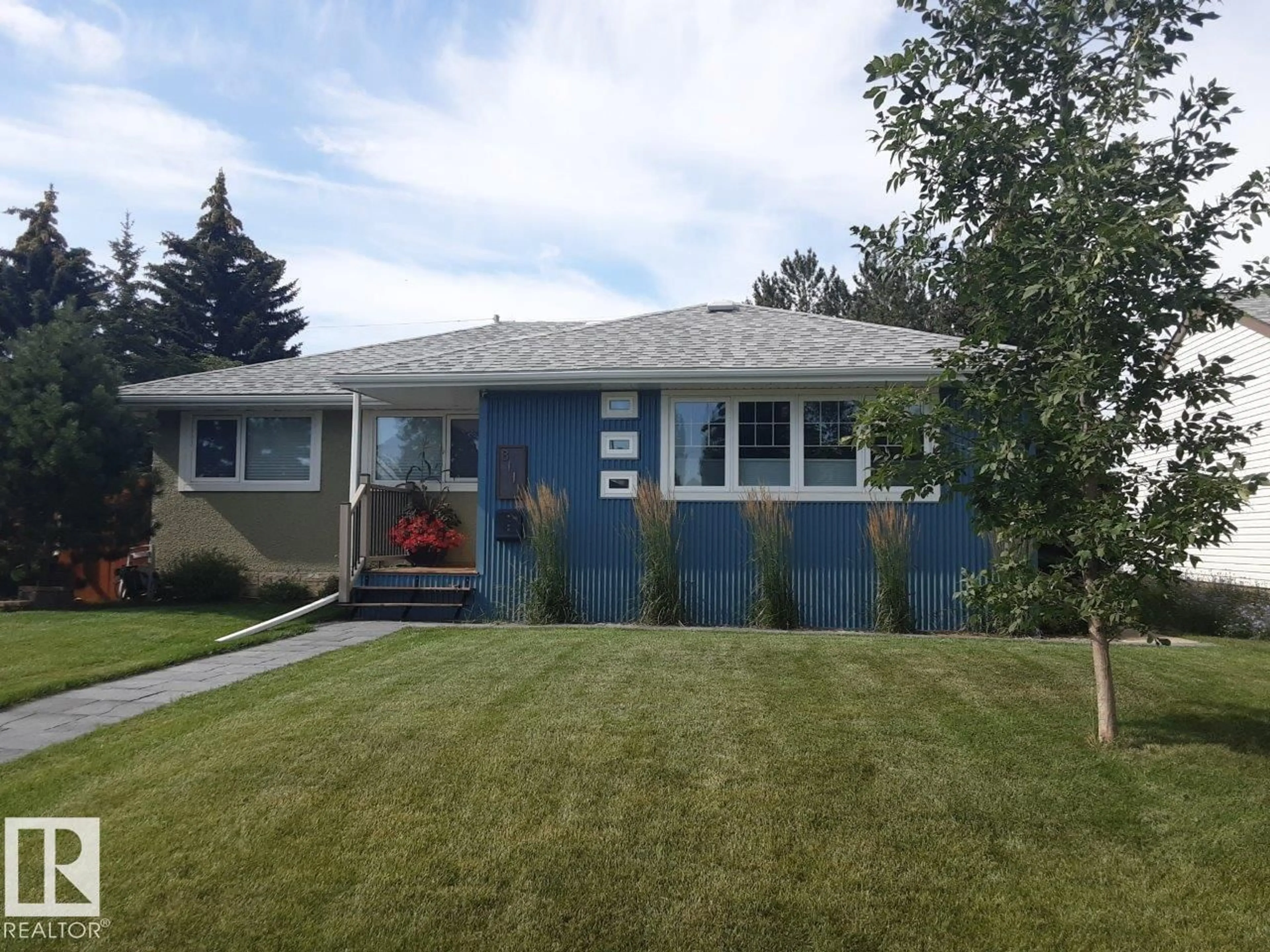 Home with vinyl exterior material, street for 8111 70 AV, Edmonton Alberta T6C0A6