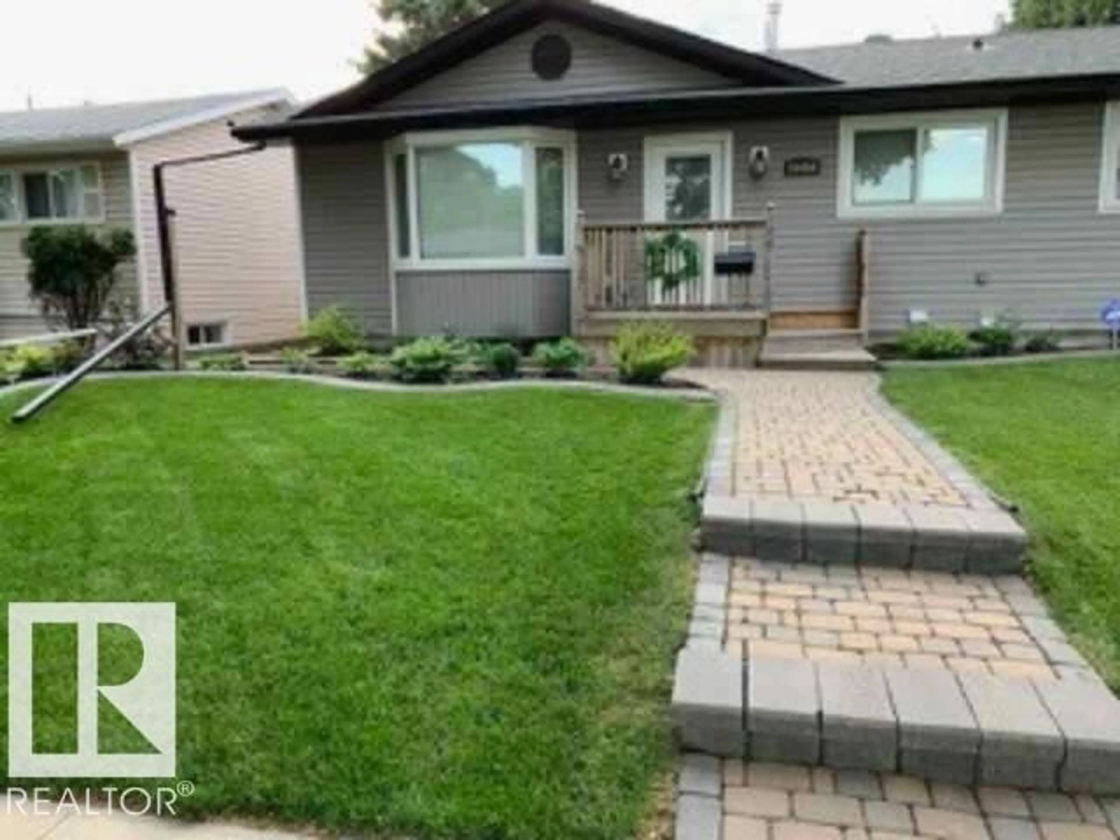 Home with vinyl exterior material, street for NW - 10454 166 ST, Edmonton Alberta T5P4C7