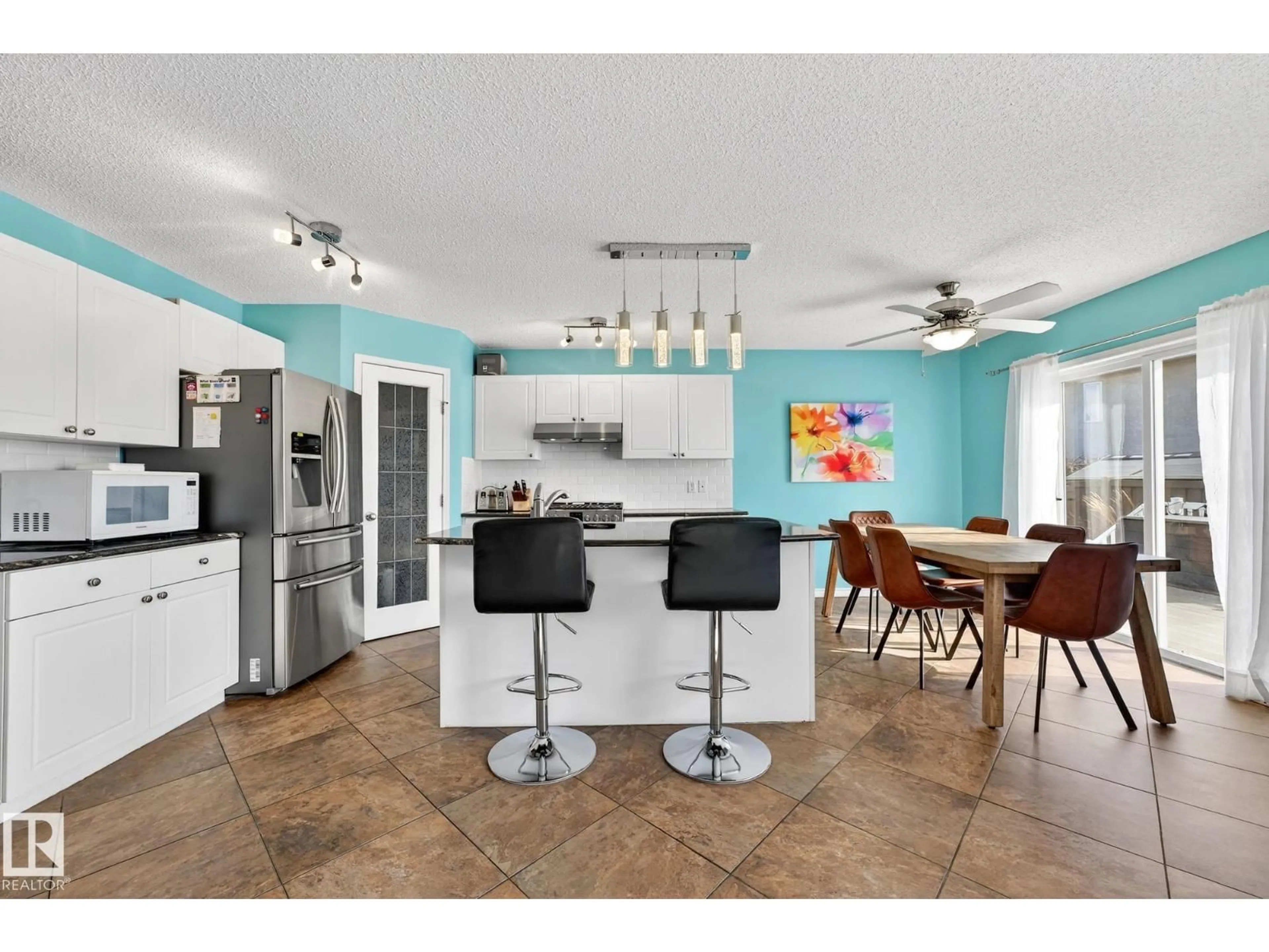 Open concept kitchen, ceramic/tile floor for 16004 91 ST, Edmonton Alberta T5Z3P4