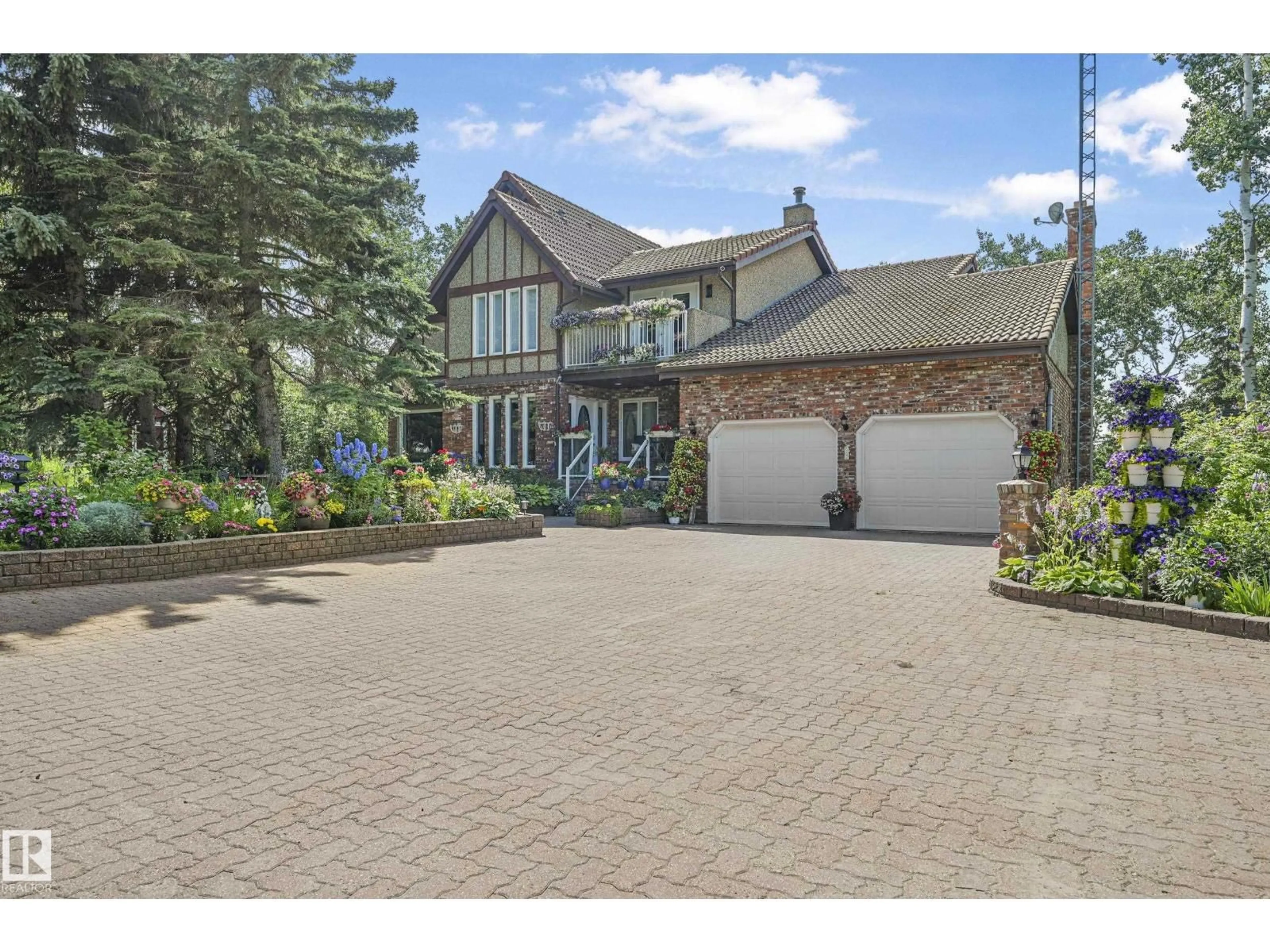 A pic from outside/outdoor area/front of a property/back of a property/a pic from drone, street for 11 - 474012 RGE ROAD 242, Rural Wetaskiwin County Alberta T0C1Z0