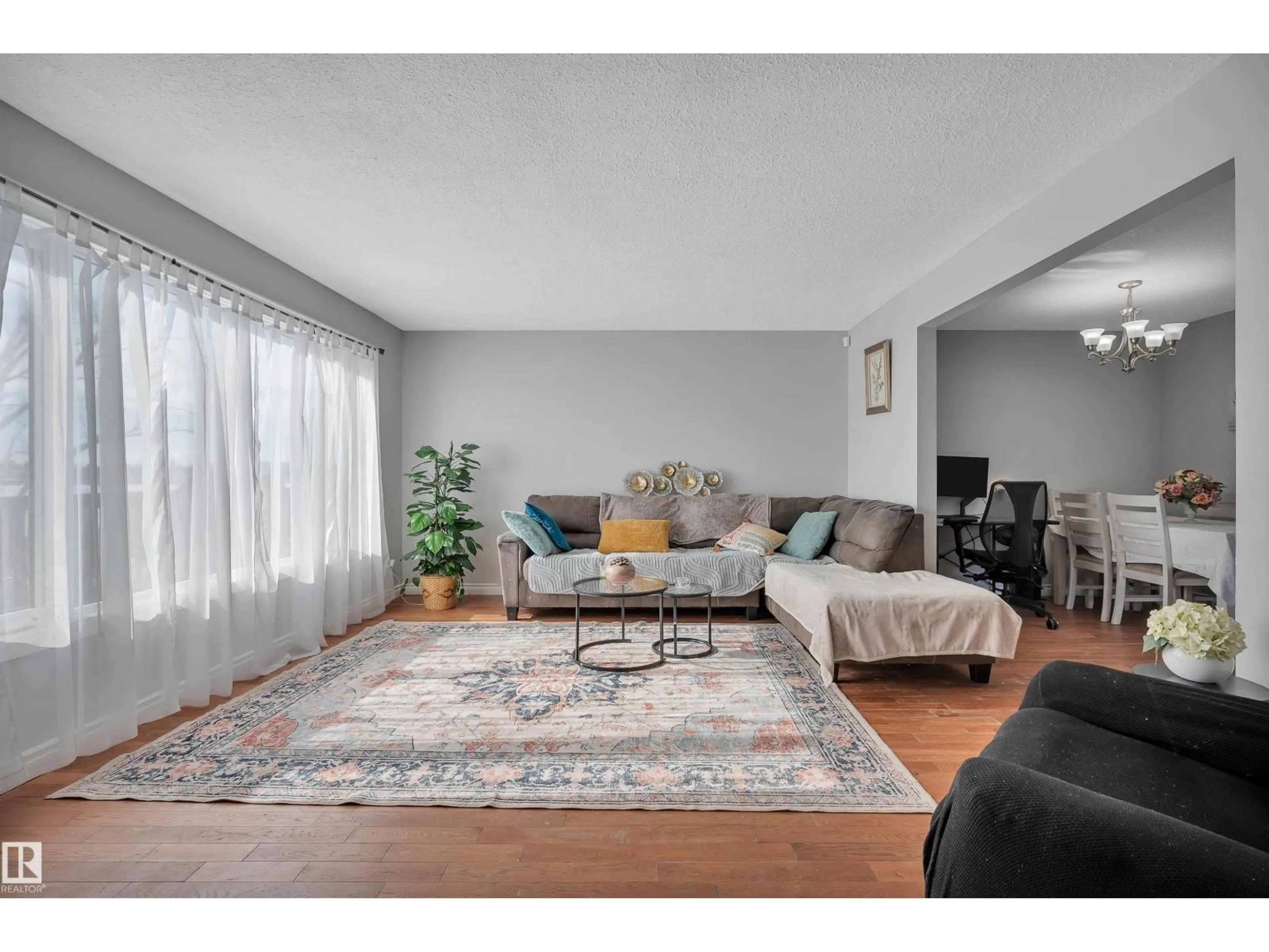 Living room with furniture, wood/laminate floor for NW - 8408 133 A AV, Edmonton Alberta T5E1E9