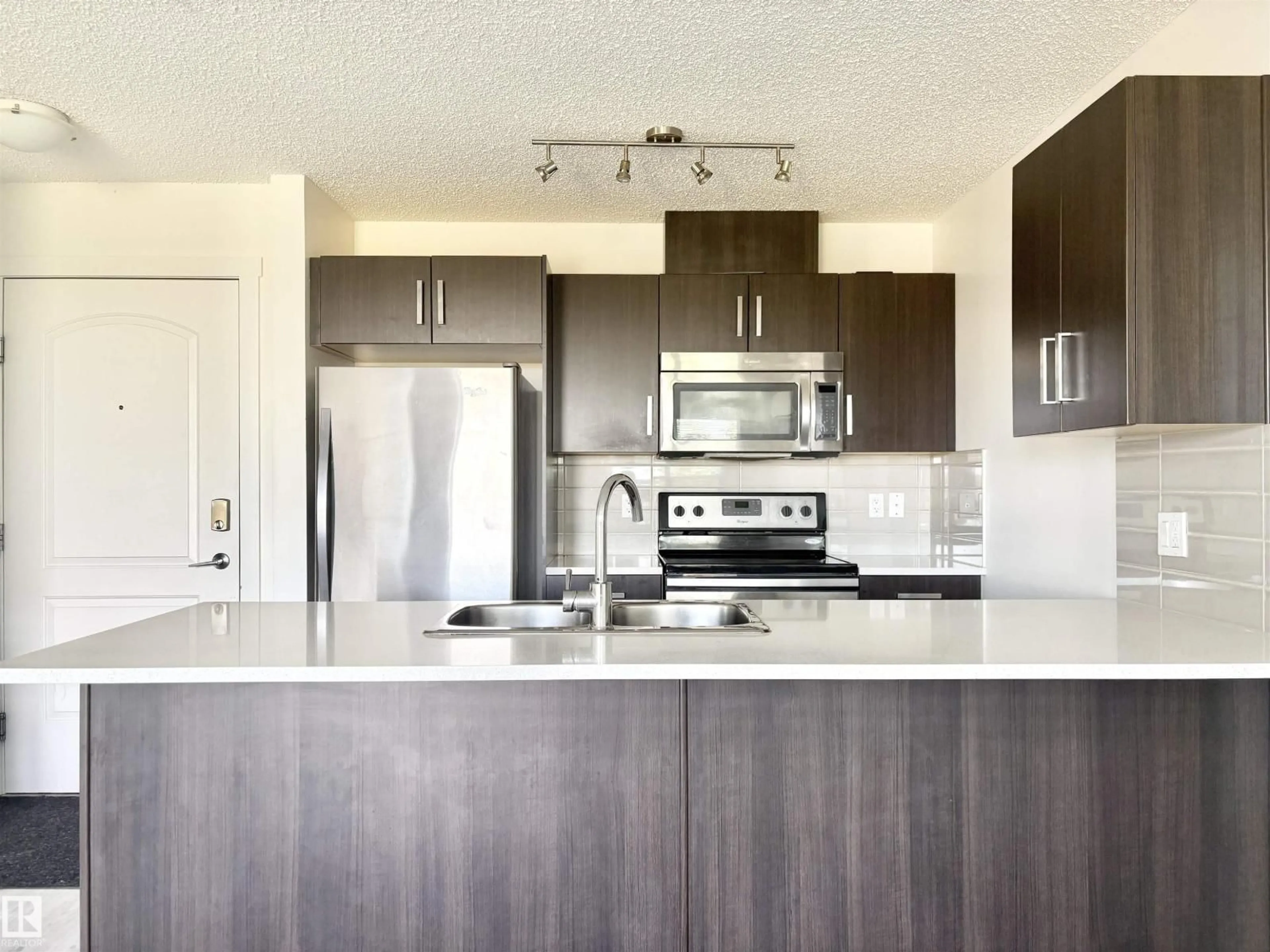Open concept kitchen, unknown for 312 - 667 WATT BV, Edmonton Alberta T6X0Y2