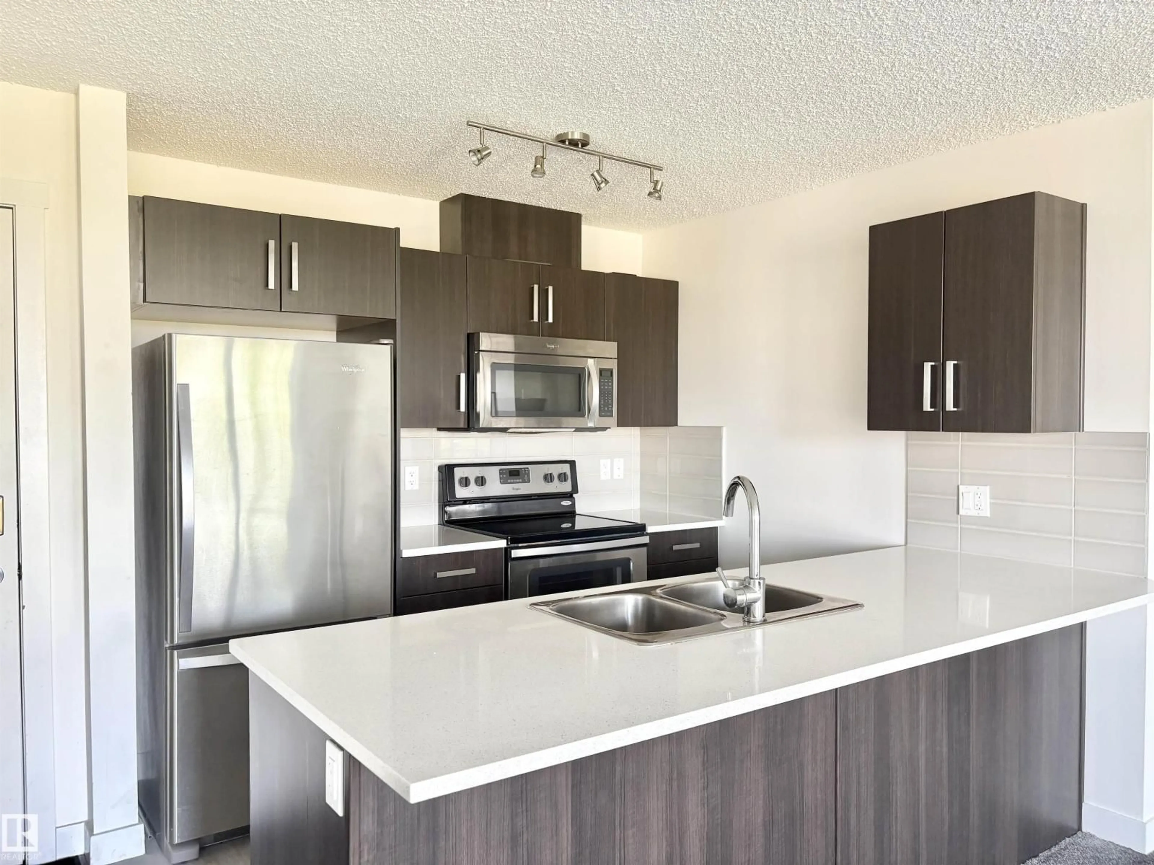 Open concept kitchen, unknown for 312 - 667 WATT BV, Edmonton Alberta T6X0Y2