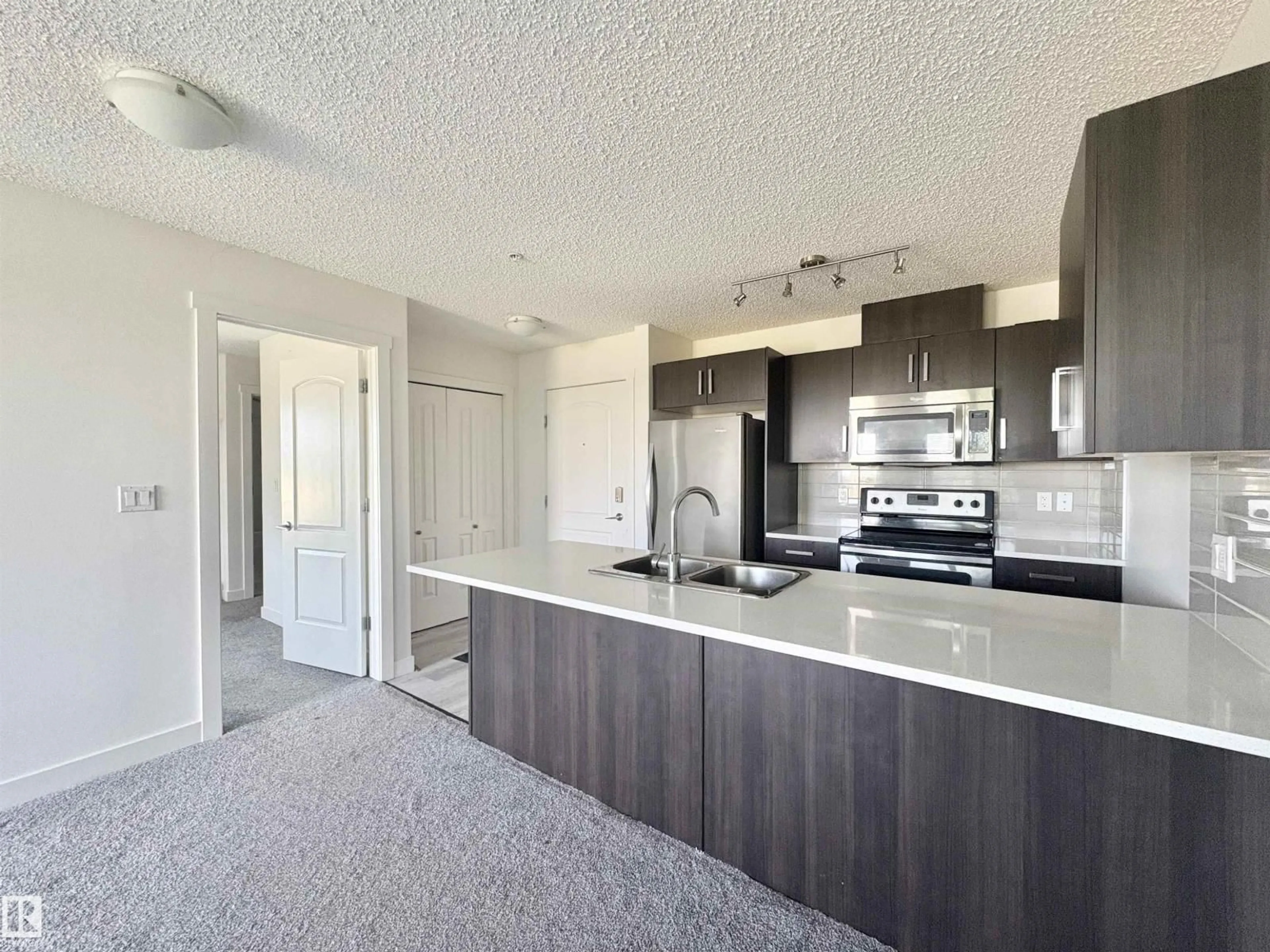Open concept kitchen, unknown for 312 - 667 WATT BV, Edmonton Alberta T6X0Y2