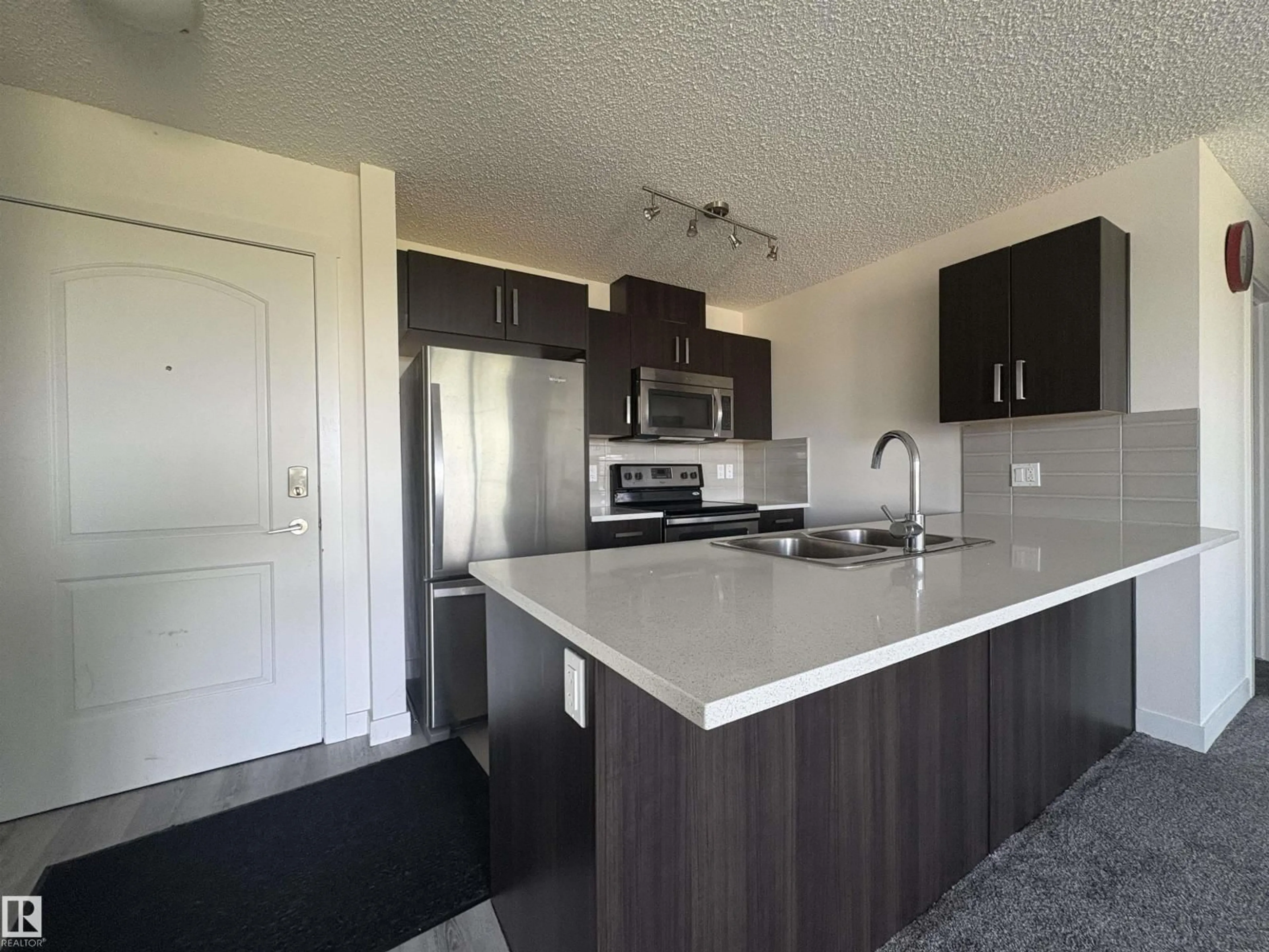 Open concept kitchen, unknown for 312 - 667 WATT BV, Edmonton Alberta T6X0Y2