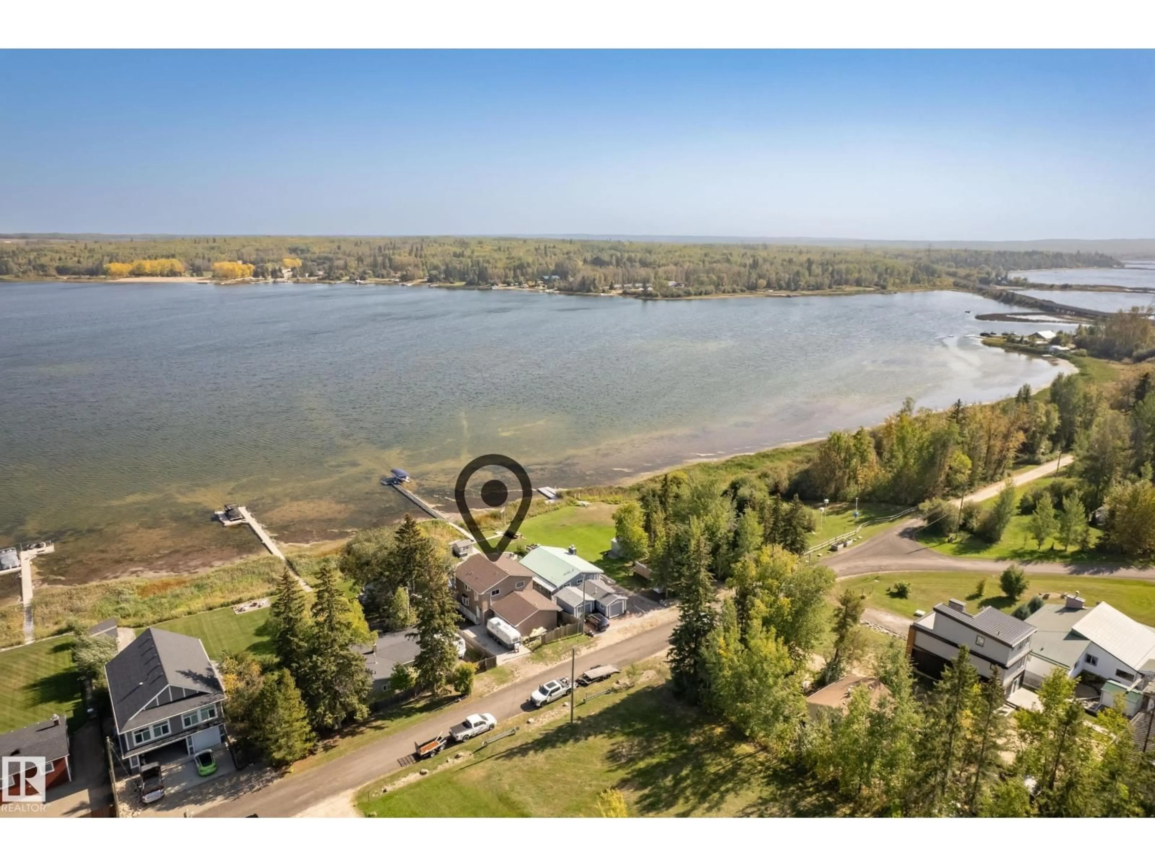 A pic from outside/outdoor area/front of a property/back of a property/a pic from drone, water/lake/river/ocean view for 104 BAYVIEW DR, Rural Parkland County Alberta T0E2K0