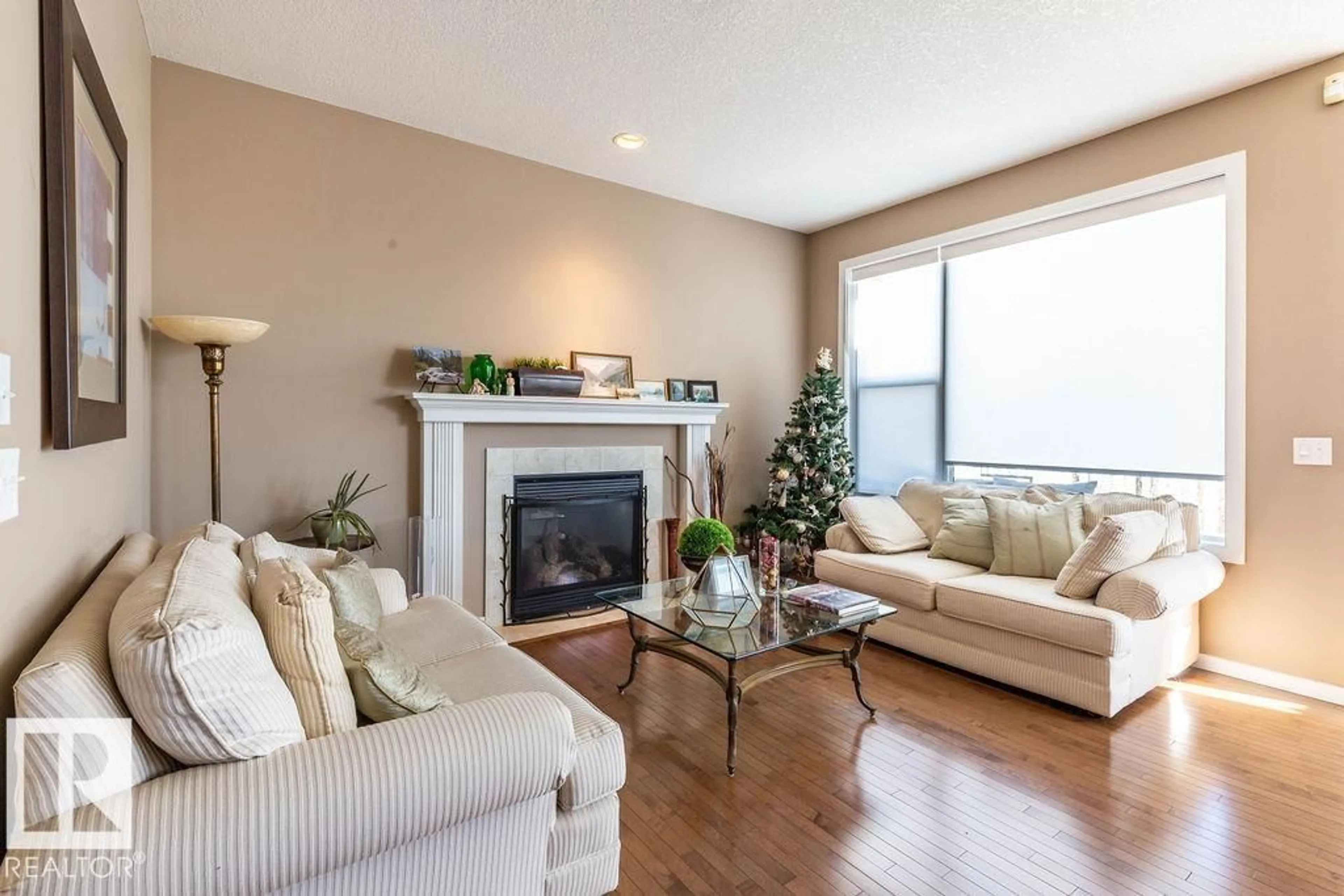 Living room with furniture, wood/laminate floor for SW - 1119 82 ST, Edmonton Alberta T6X1E5