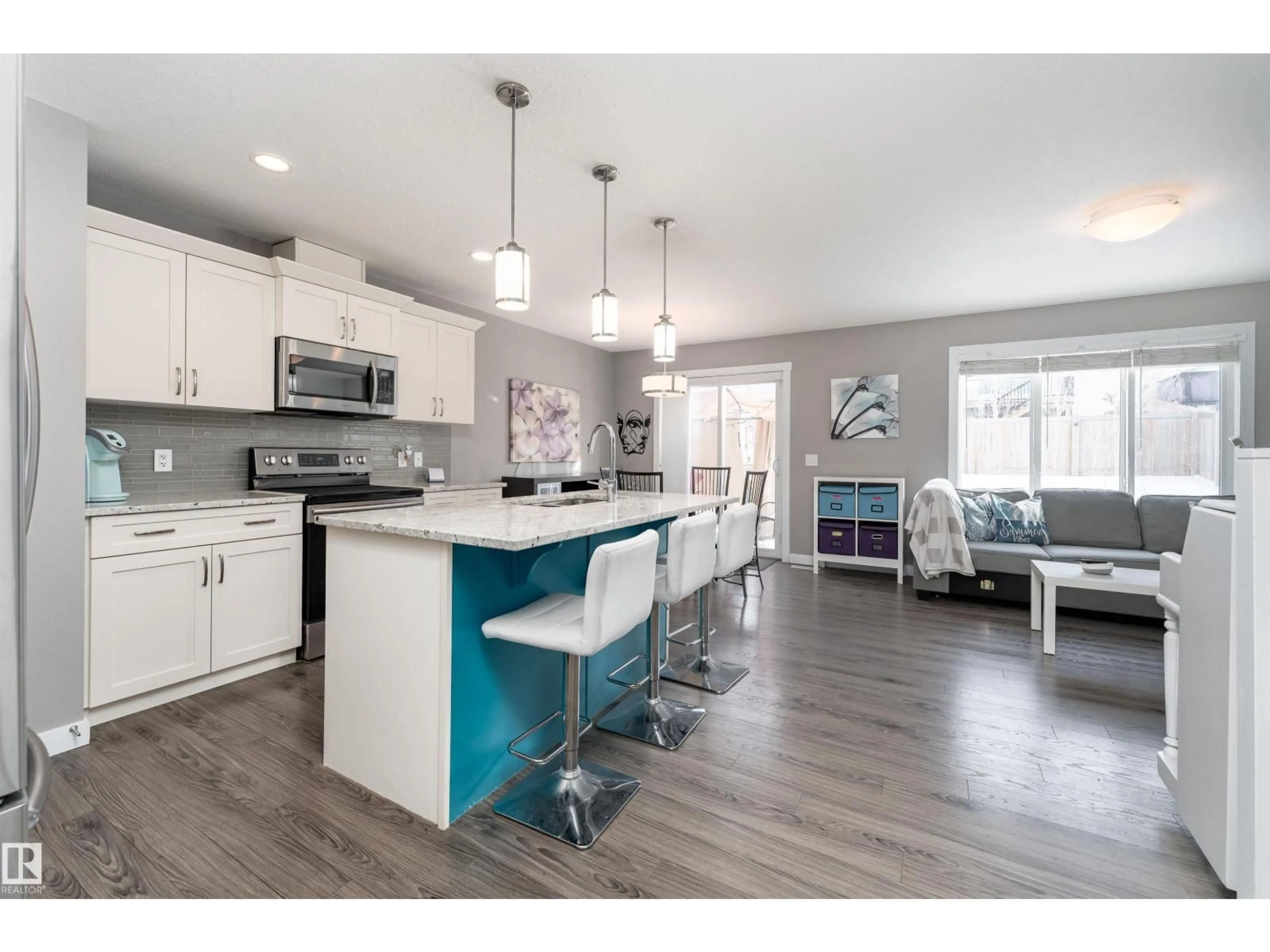 Open concept kitchen, wood/laminate floor for 121 ABBEY RD, Sherwood Park Alberta T8H0Z2