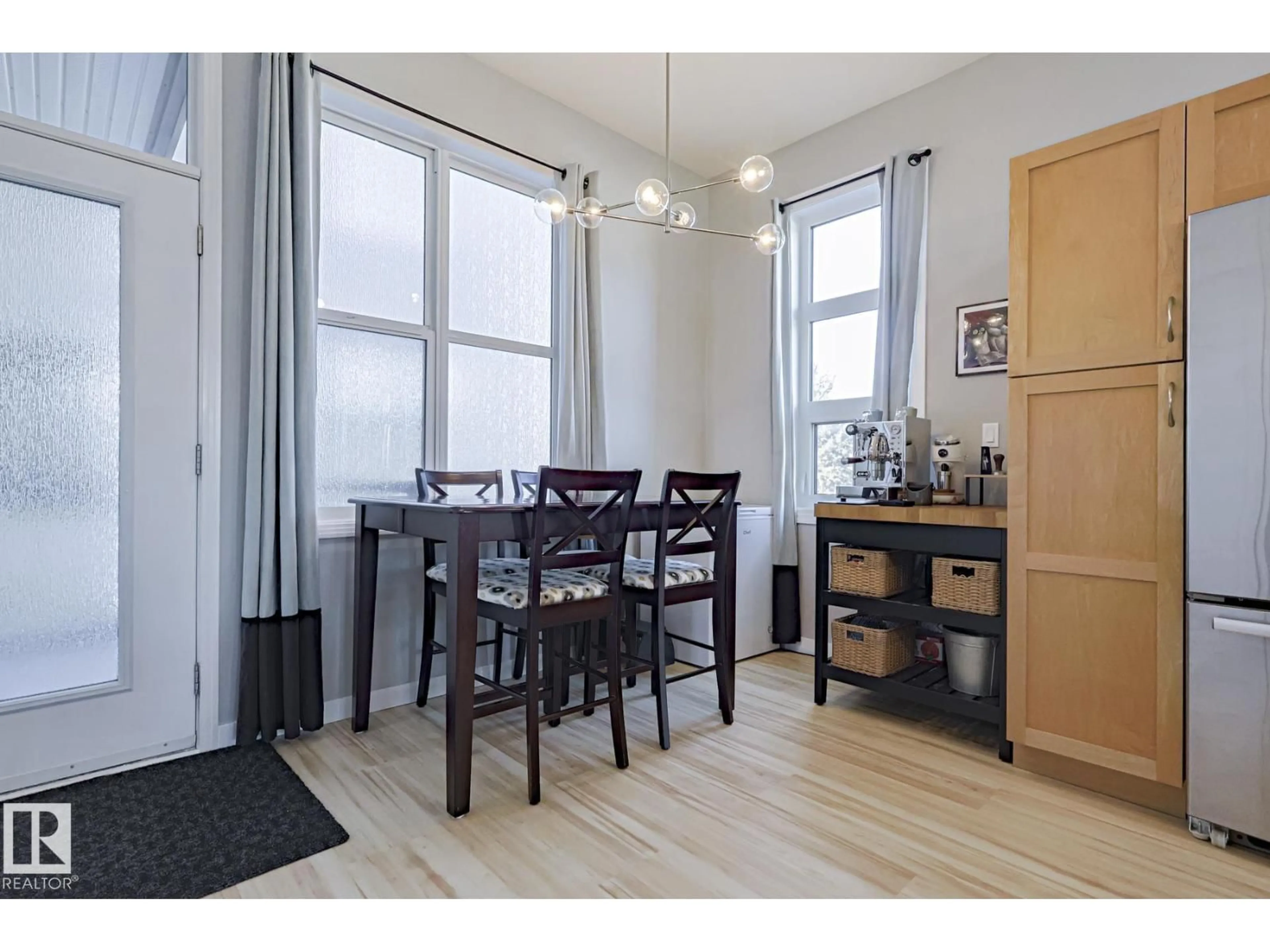 Dining room, wood/laminate floor for NW - 225 10531 117 ST, Edmonton Alberta T5H0A8