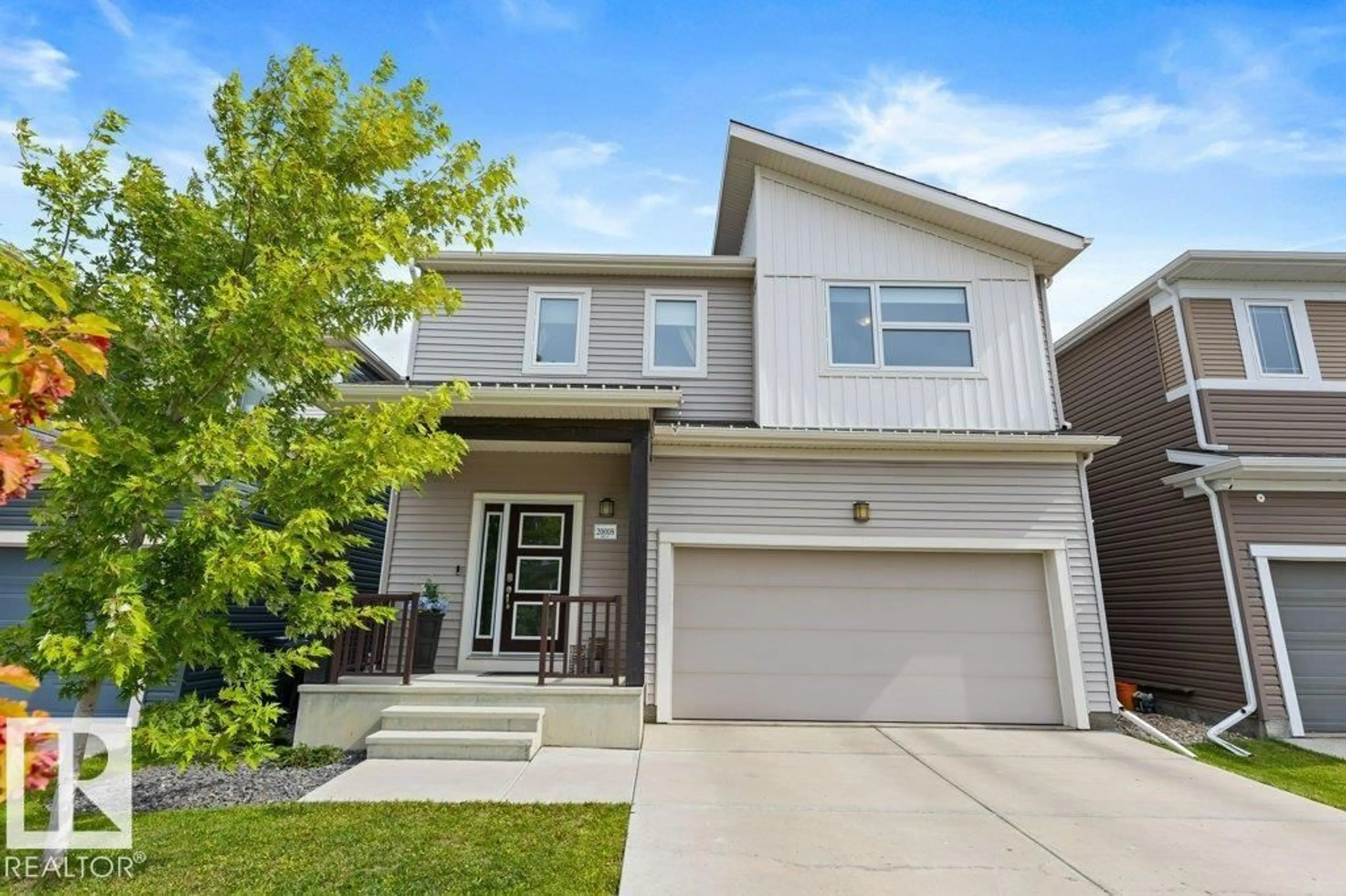 Home with vinyl exterior material, street for 20008 18 AV, Edmonton Alberta T6M0Y1