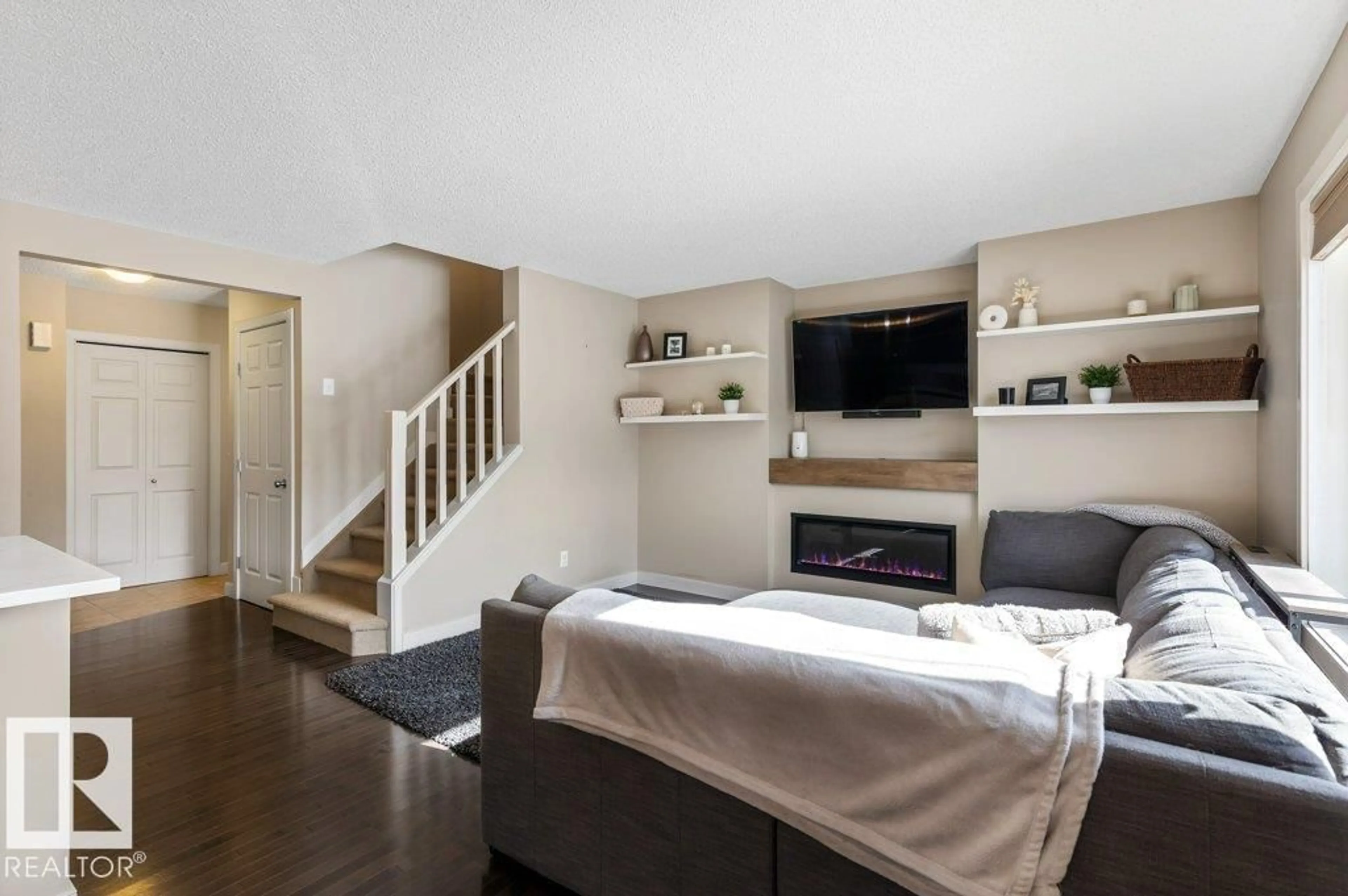 Living room with furniture, wood/laminate floor for 20011 131 AV, Edmonton Alberta T5S0E1