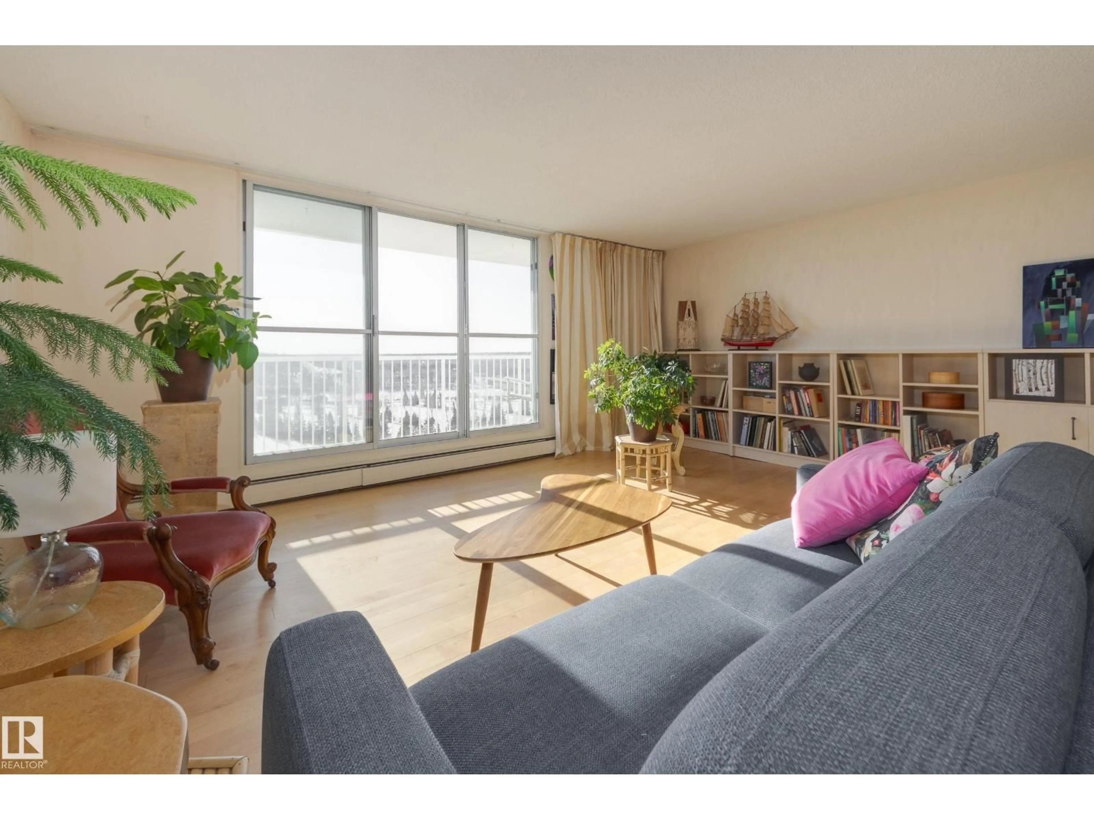 Living room with furniture, wood/laminate floor for #306 - 12121 JASPER AV, Edmonton Alberta T5N3X7