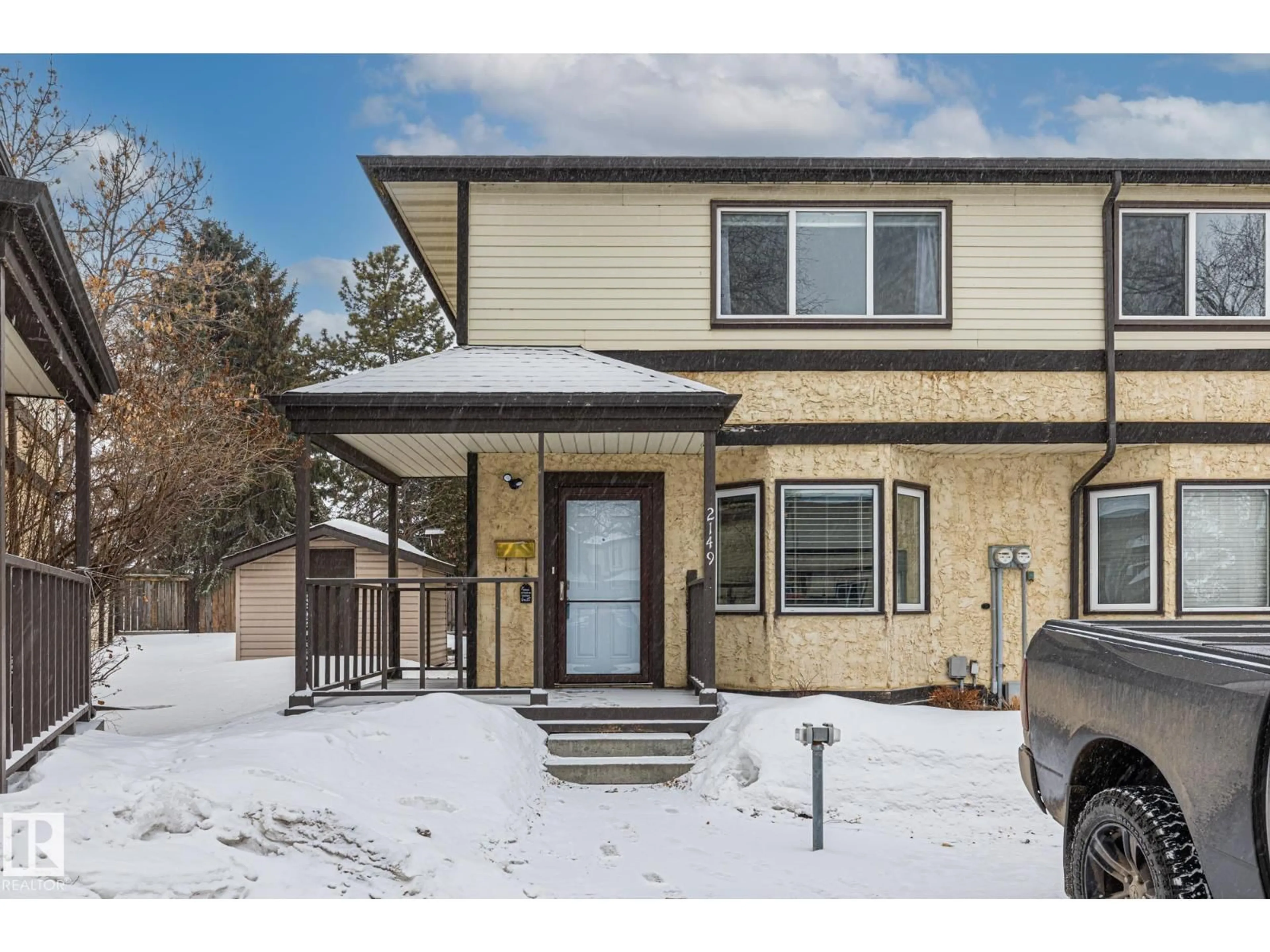 Home with brick exterior material, street for 2149 141 AV, Edmonton Alberta T5Y1C4