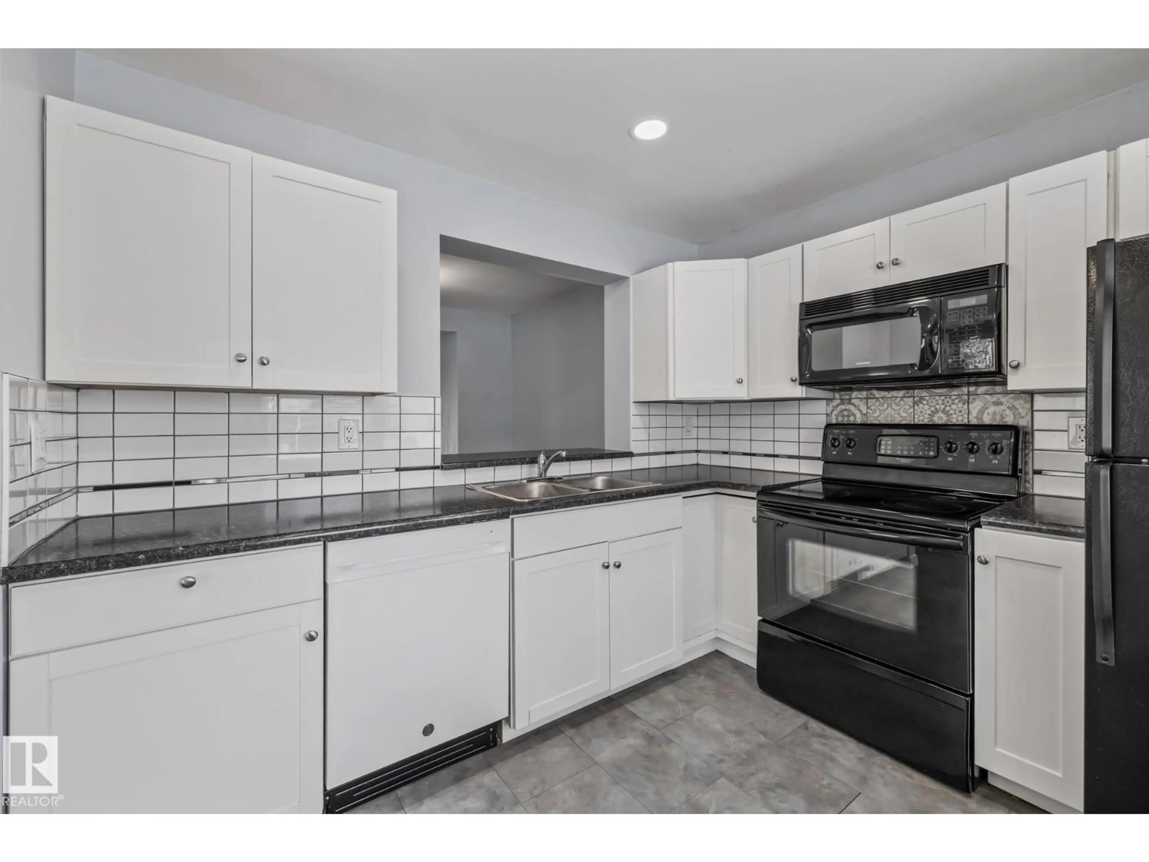 Standard kitchen, ceramic/tile floor for 2149 141 AV, Edmonton Alberta T5Y1C4