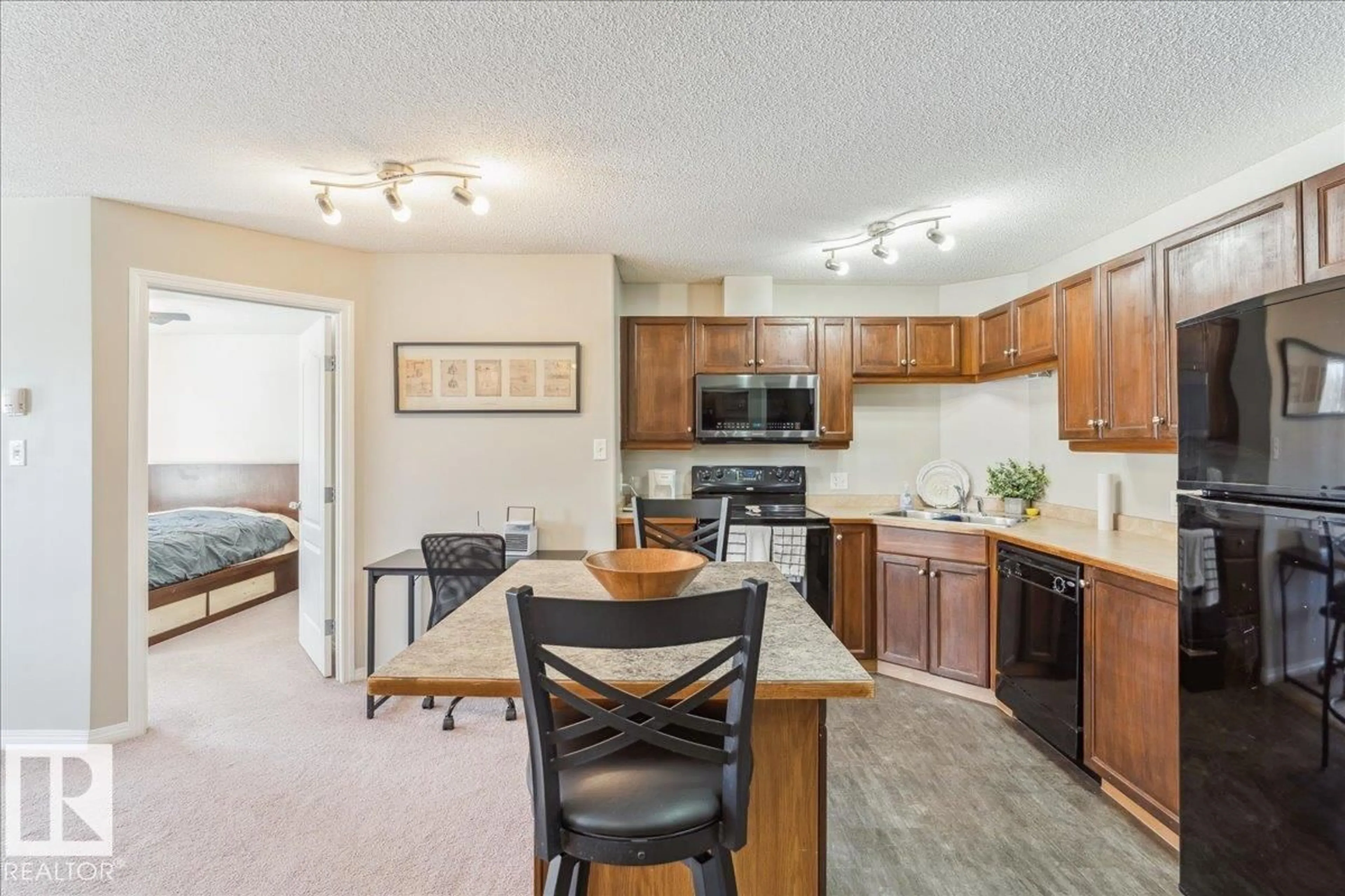 Open concept kitchen, unknown for #112 - 5340 199 ST, Edmonton Alberta T6M0A5