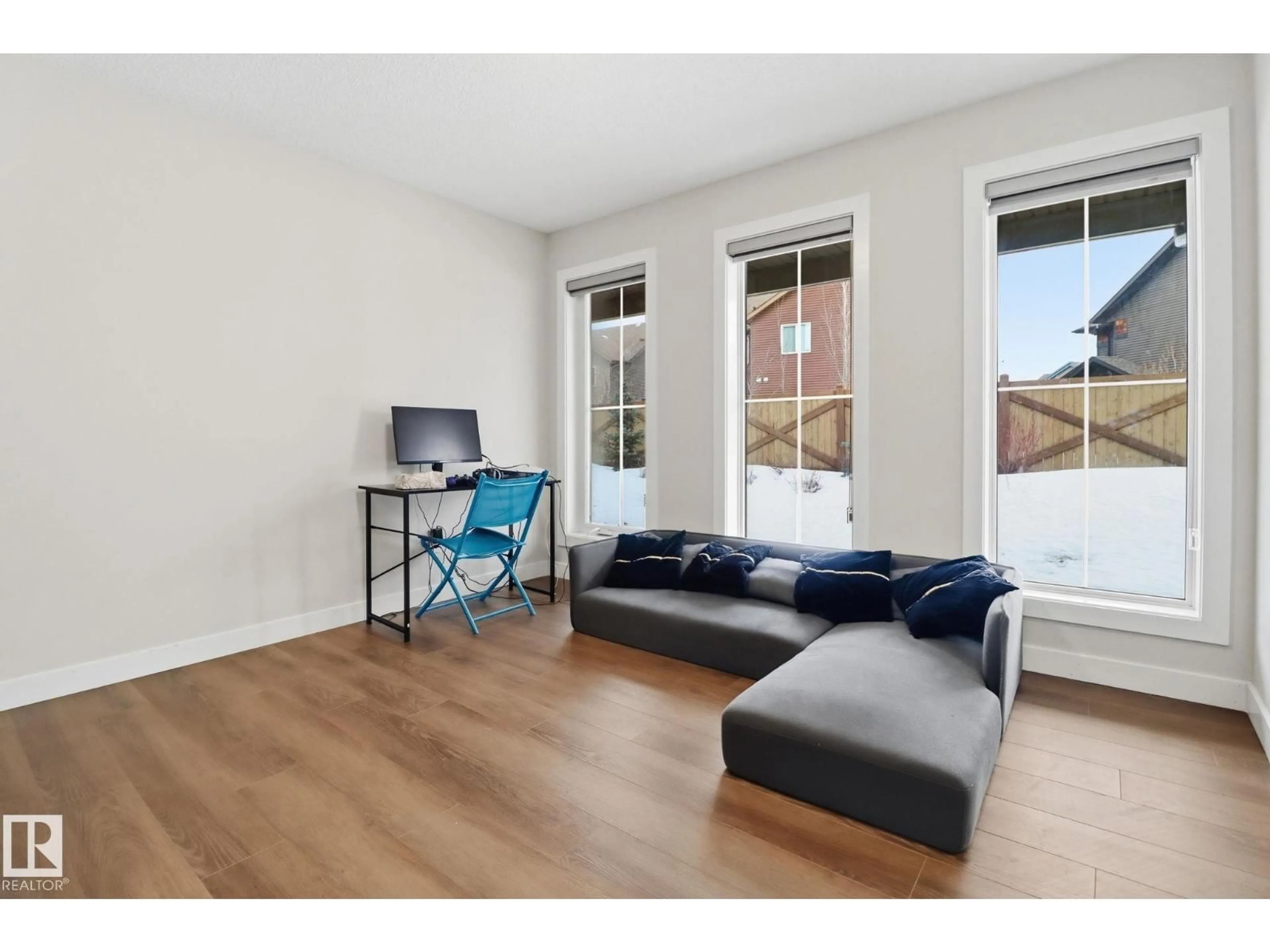 Living room with furniture, wood/laminate floor for 25 - 1051 GRAYDON HILL BV, Edmonton Alberta T6W3C8