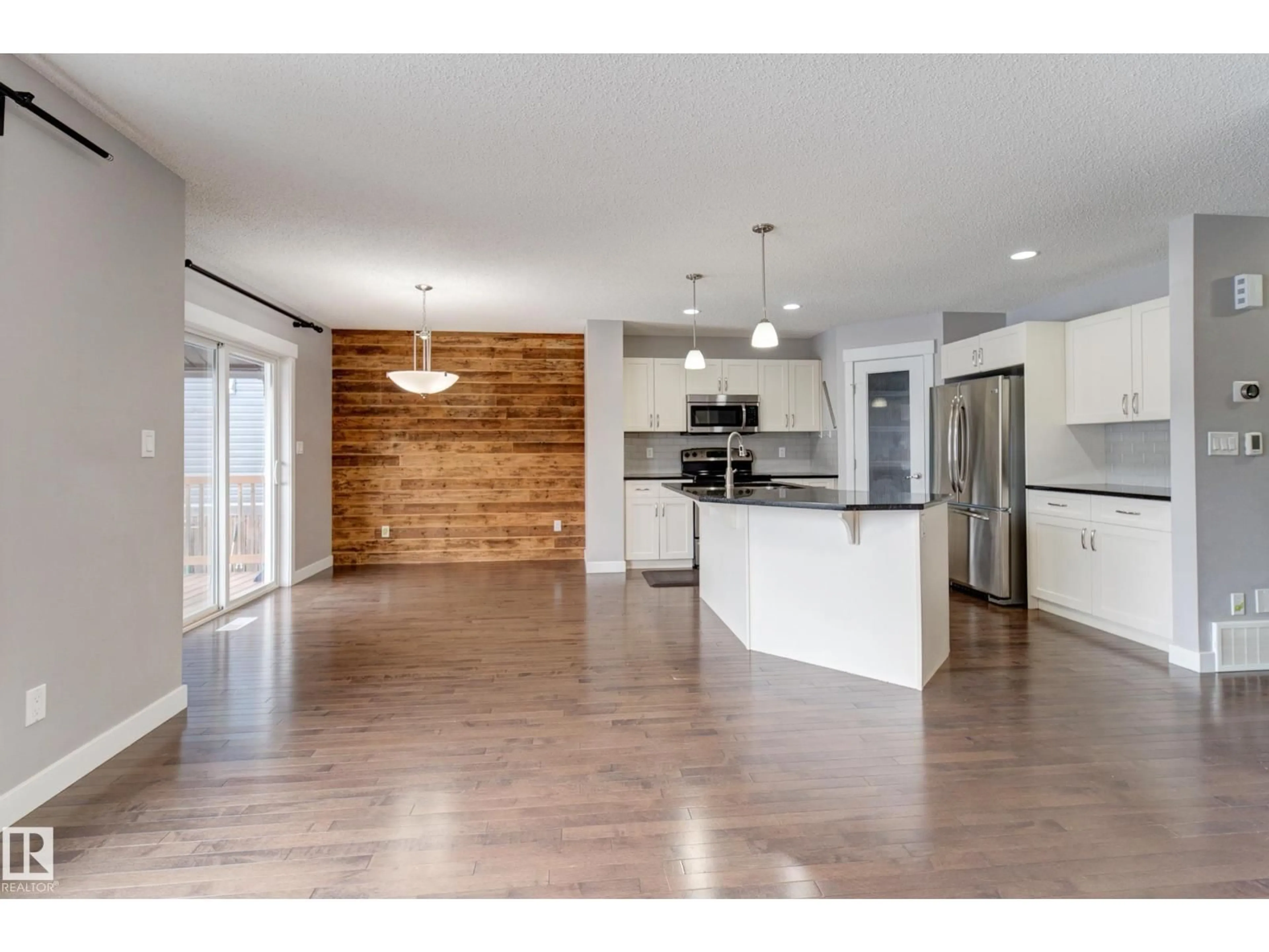 Open concept kitchen, wood/laminate floor for 475 REED CR, Leduc Alberta T9E0R5