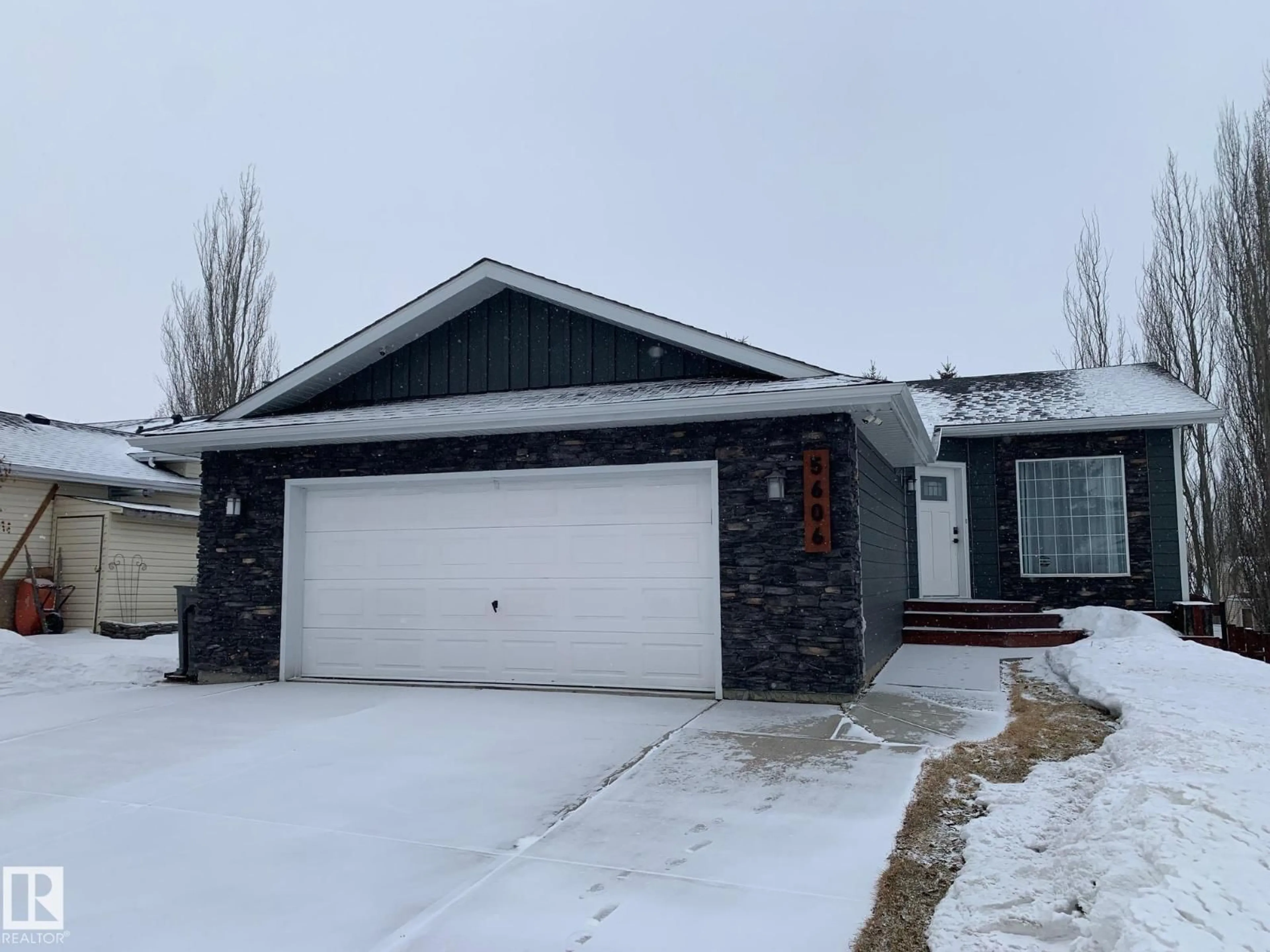 Home with vinyl exterior material, street for 5606 55 ST, Beaumont Alberta T4X1A7