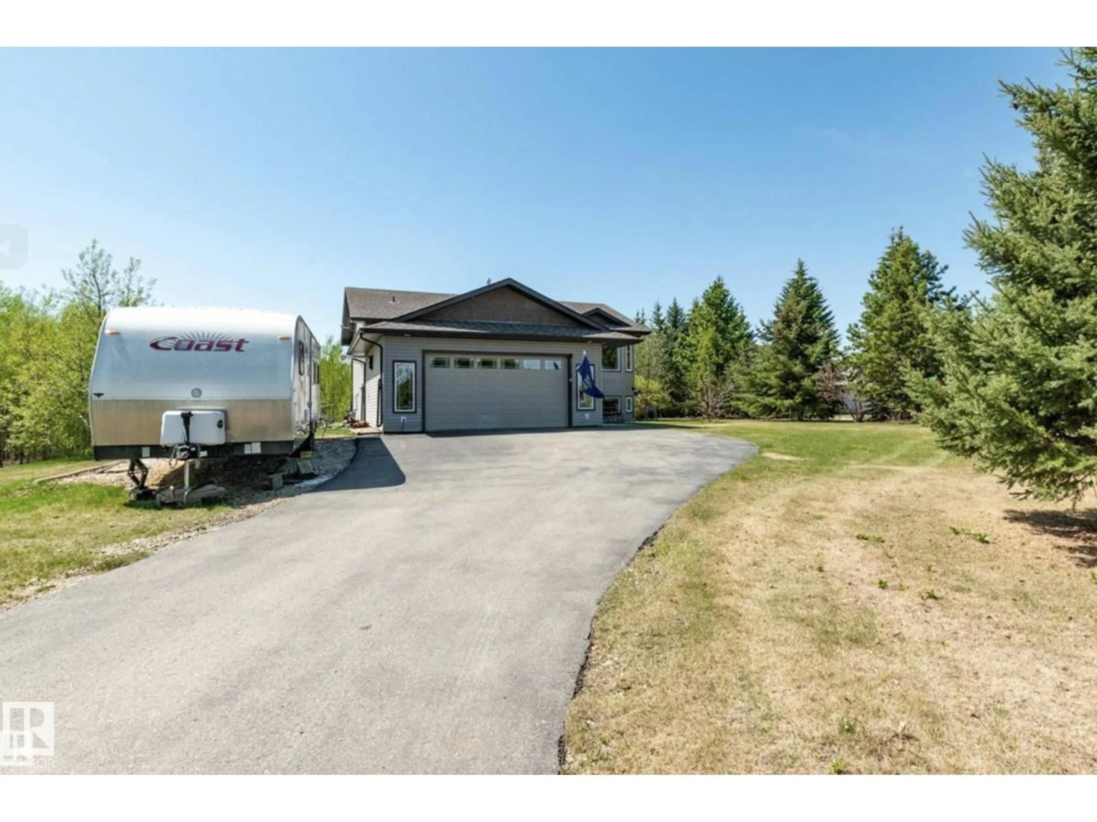 A pic from outside/outdoor area/front of a property/back of a property/a pic from drone, street for #123 - 52318 RGE ROAD 25, Rural Parkland County Alberta T7Y2M3