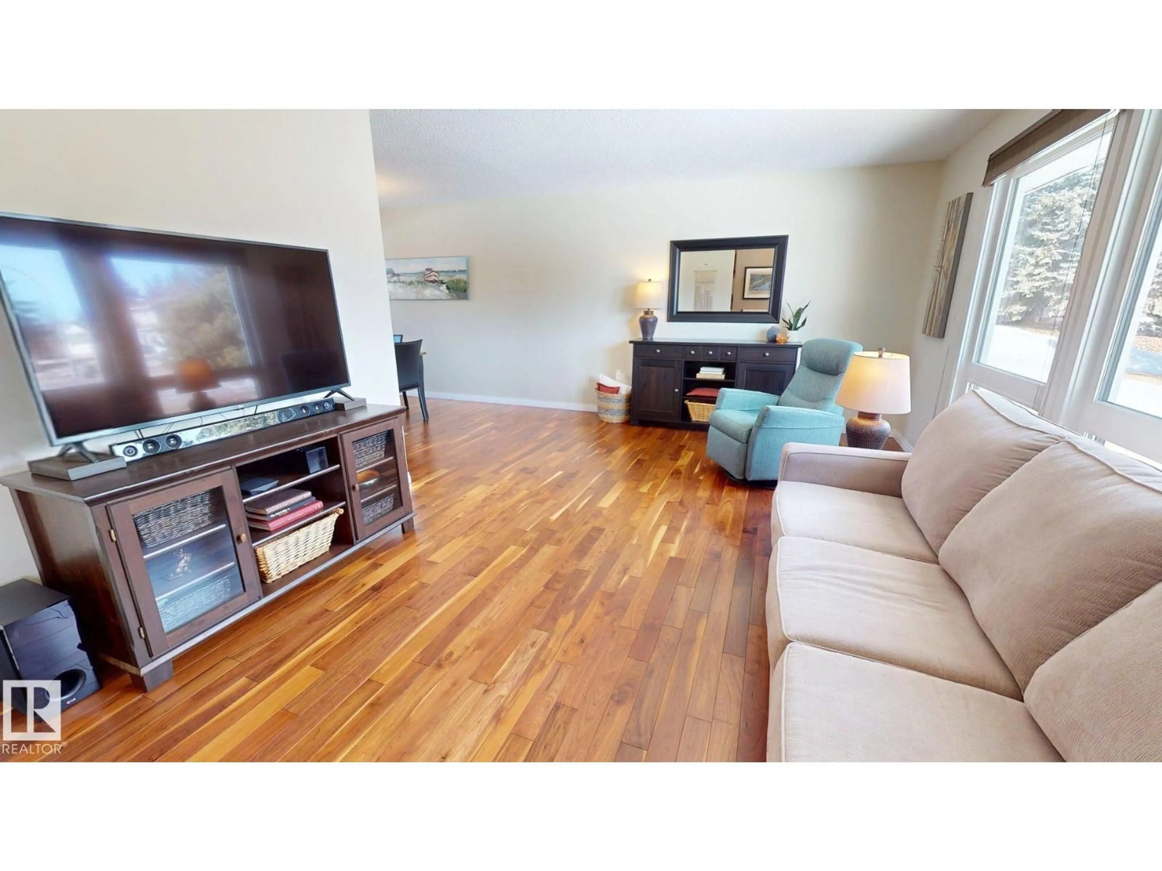 Living room with furniture, wood/laminate floor for 8 GUILFORD ST, Sherwood Park Alberta T8A3H2
