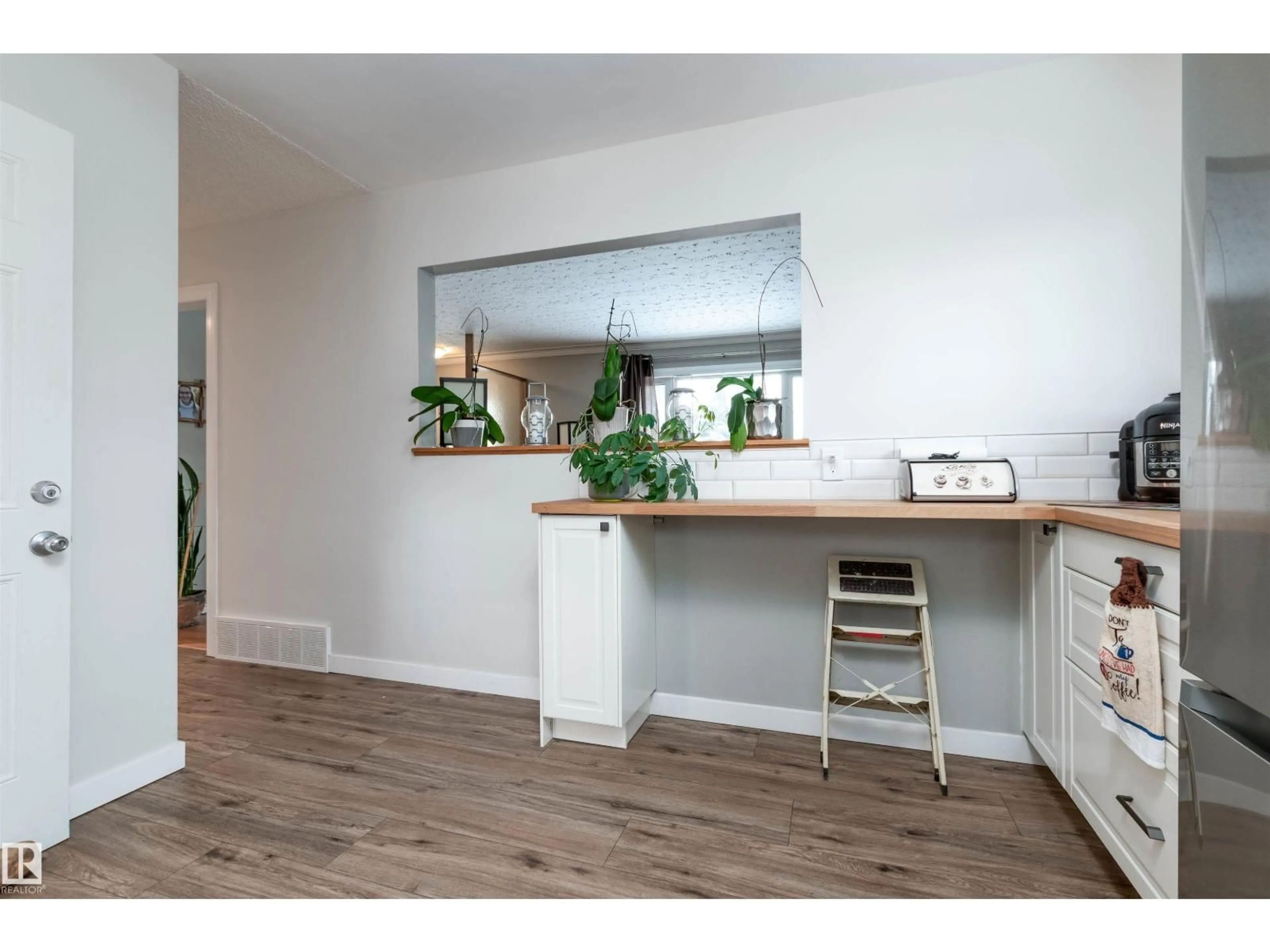 Open concept kitchen, wood/laminate floor for NW - 12836 107 ST, Edmonton Alberta T5E4V3