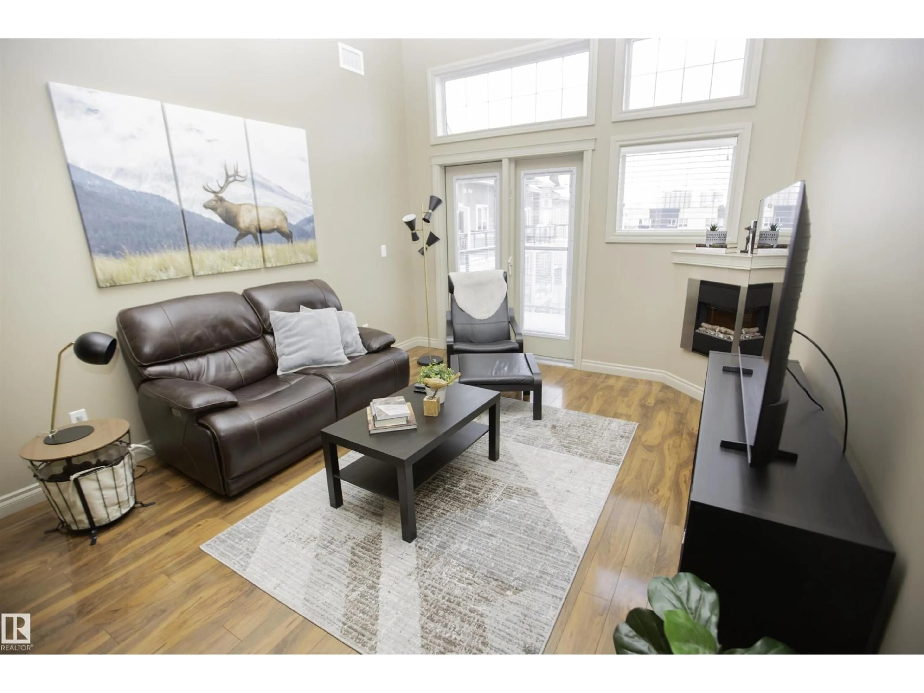 Living room with furniture, wood/laminate floor for 432 10121 80 AV AV, Edmonton Alberta T6E0B9